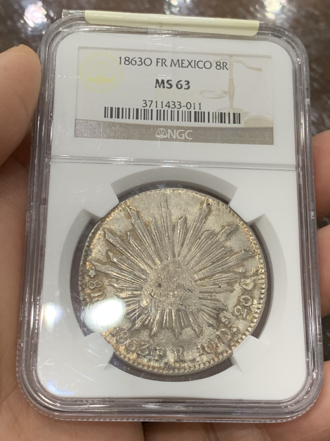 欢迎参加《竞宝斋》五一特拍-第161场-周日，周一 2场 NGC MS63 1863 O FR 墨西哥  早期鹰洋8里亚尔银币，特别粗壮，大名誉品