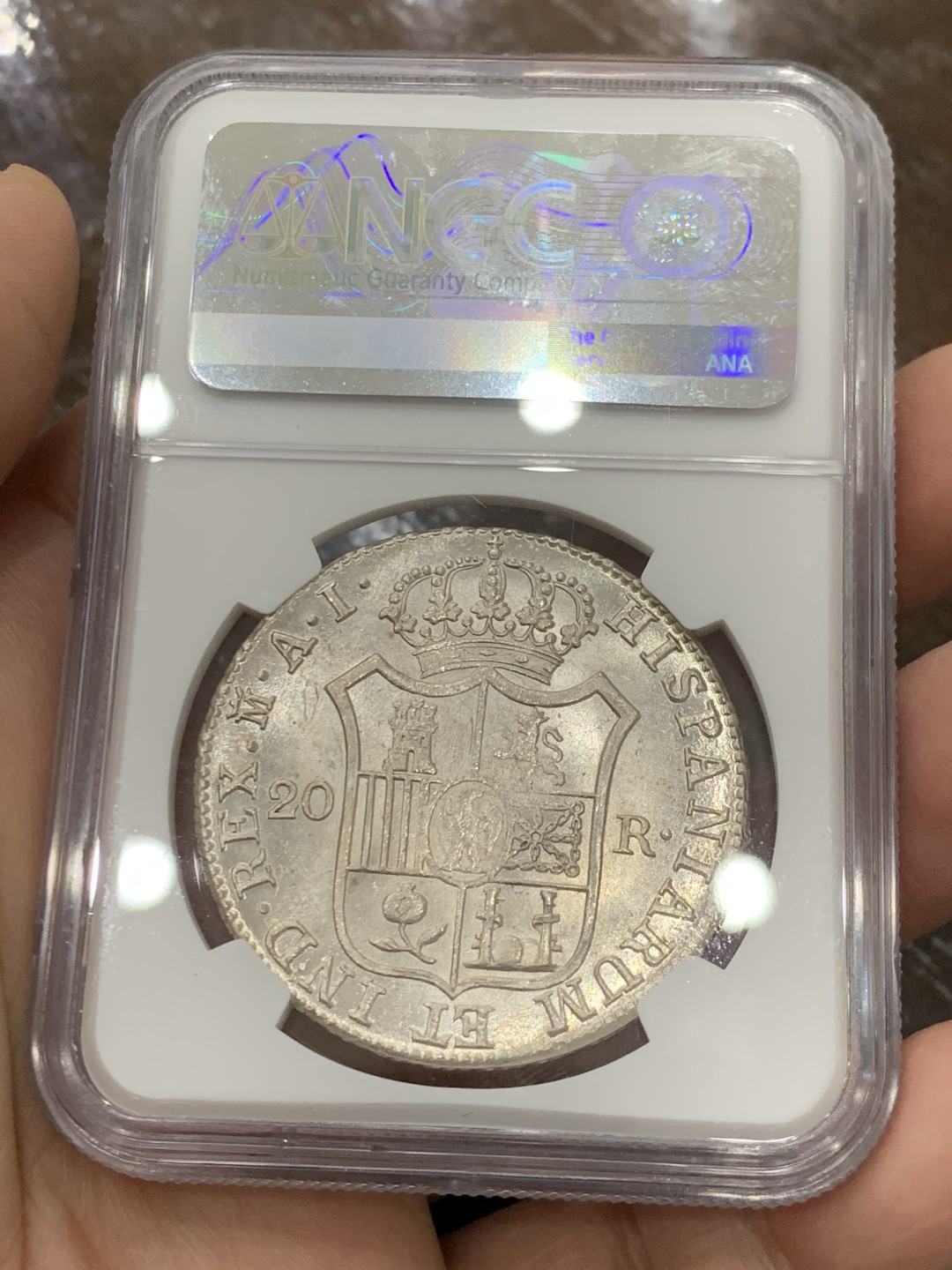 欢迎参加《竞宝斋》五一特拍-第161场-周日，周一 2场 NGC MS62 1810年 法占西班牙 约瑟夫拿破仑20R银币，细节极佳 发丝清晰 光感十足 可以毕业了