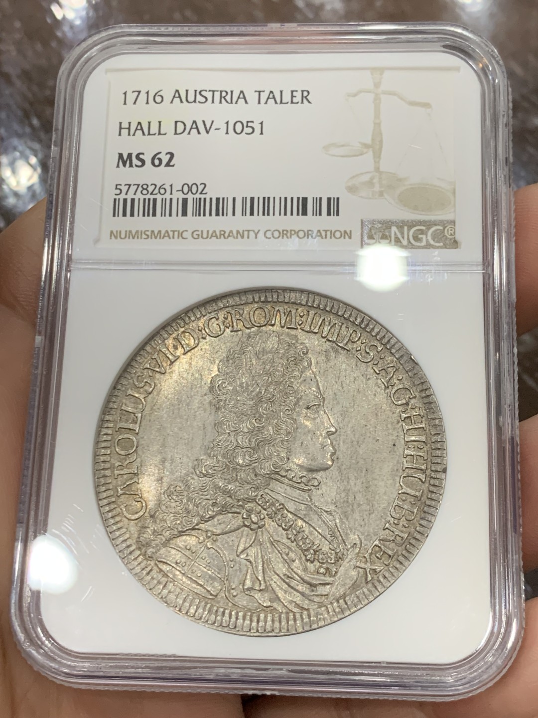 欢迎参加《竞宝斋》五一特拍-第161场-周日，周一 2场 NGC-MS62 神圣罗马帝国 1716年1泰勒银币 卡尔六世少见年轻头像，全币高点和底板没有任何磨损或丝痕，62实属低评