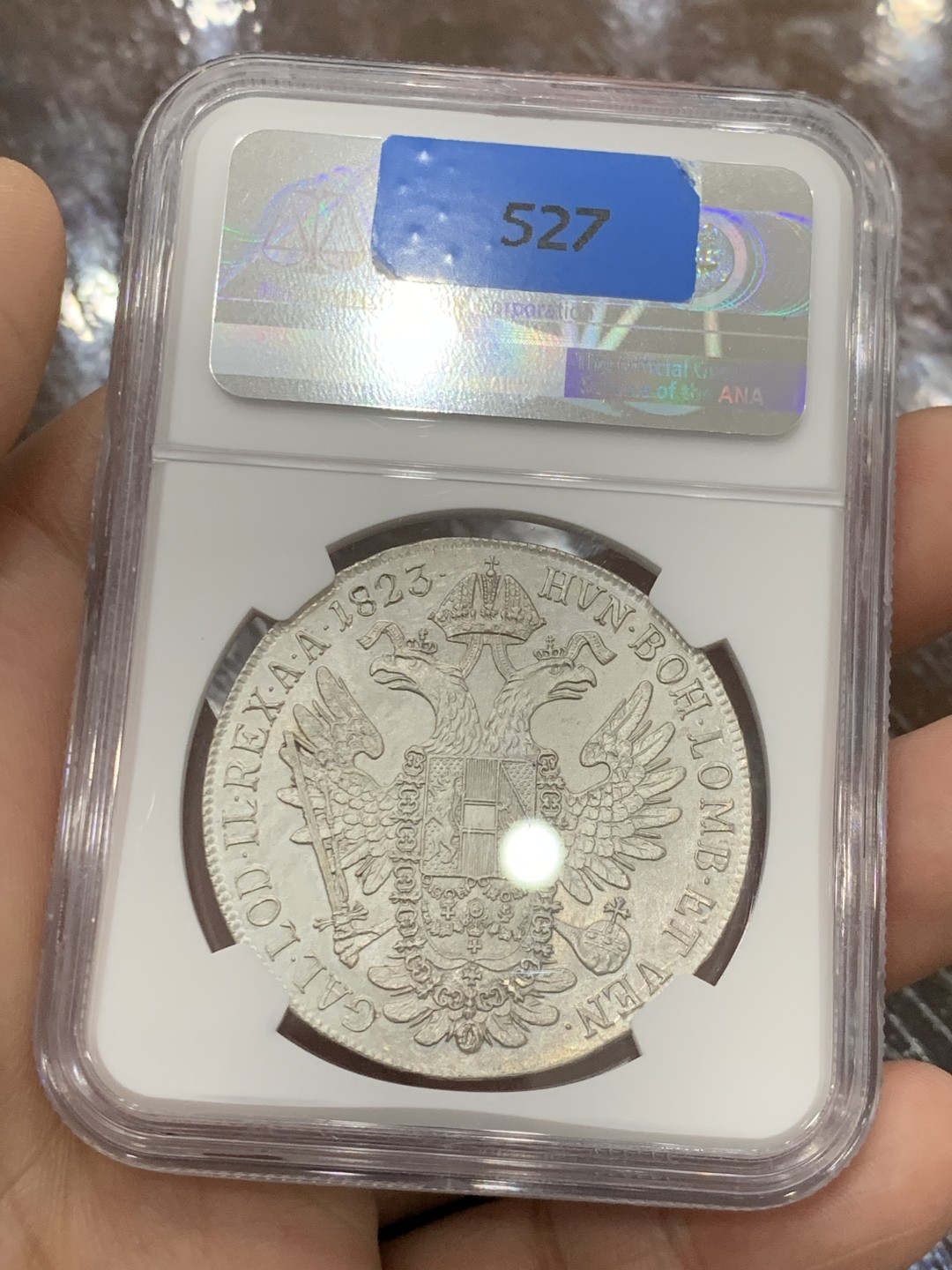 欢迎参加《竞宝斋》五一特拍-第161场-周日，周一 2场 NGC-MS62 奥地利帝国 1823-C 弗朗茨一世泰勒 N/P唯一冠军分 鹰面浮雕细腻 底板完好 收藏级高分