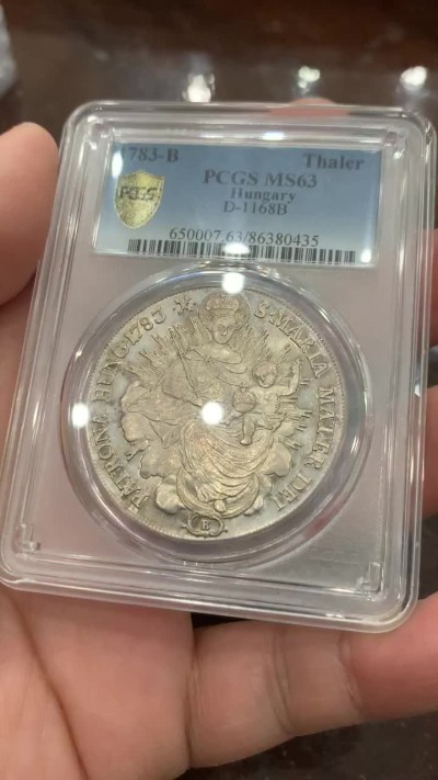 欢迎参加《竞宝斋》五一特拍-第161场-周日，周一 2场 PCGS-MS63 1783年神圣罗马帝国匈牙利圣母抱婴泰勒 热门品种，淡金包浆，全币深打，没有减重痕，极为难得。亚军分，上面只有一个63+