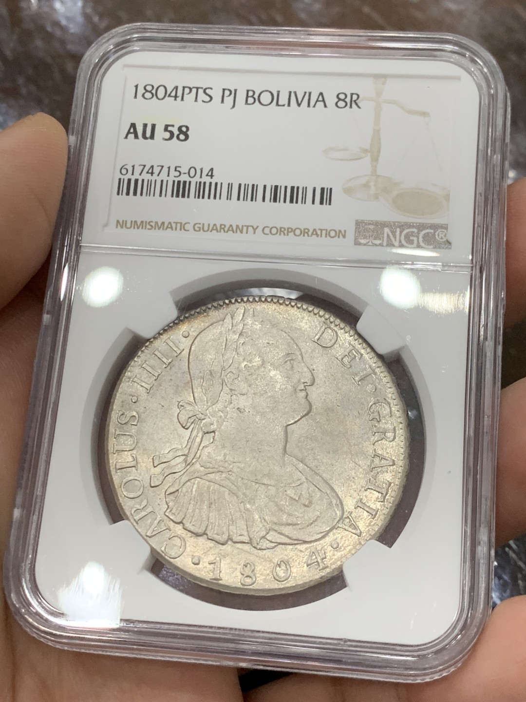 欢迎参加《竞宝斋》五一特拍-第161场-周日，周一 2场 NGC-AU58 西属玻利维亚 1804年卡四8R银币,高点俱全，底板几近无痕，铸纹还在，严重低评的一颗卡四