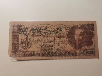 238.【鲸贝乐淘★两拍包邮】三字经·第“亲师友，习礼仪”号拍卖 【越南🇻🇳★解放区草纸币】1950年200盾，流通品相如图