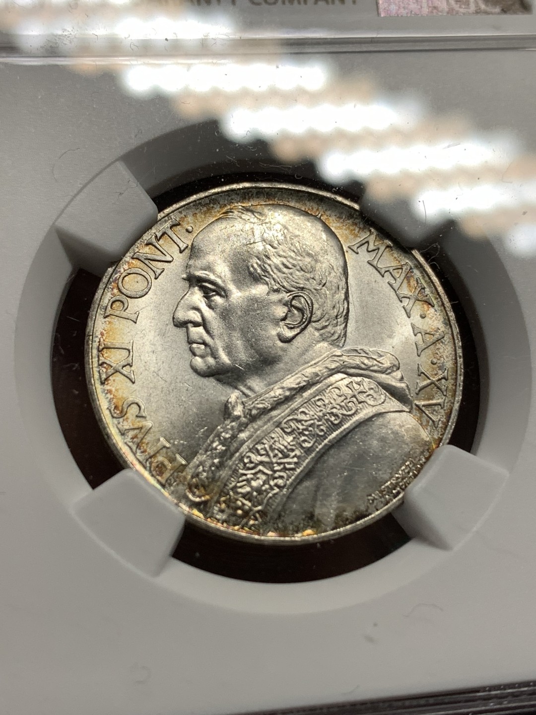 《竞宝斋》第167场-周日，周一，周四 3场 (全场包邮) NGC MS63，梵蒂冈1936年10里拉。梵蒂冈主币，带少许环彩。年底上海评，给分略有保守