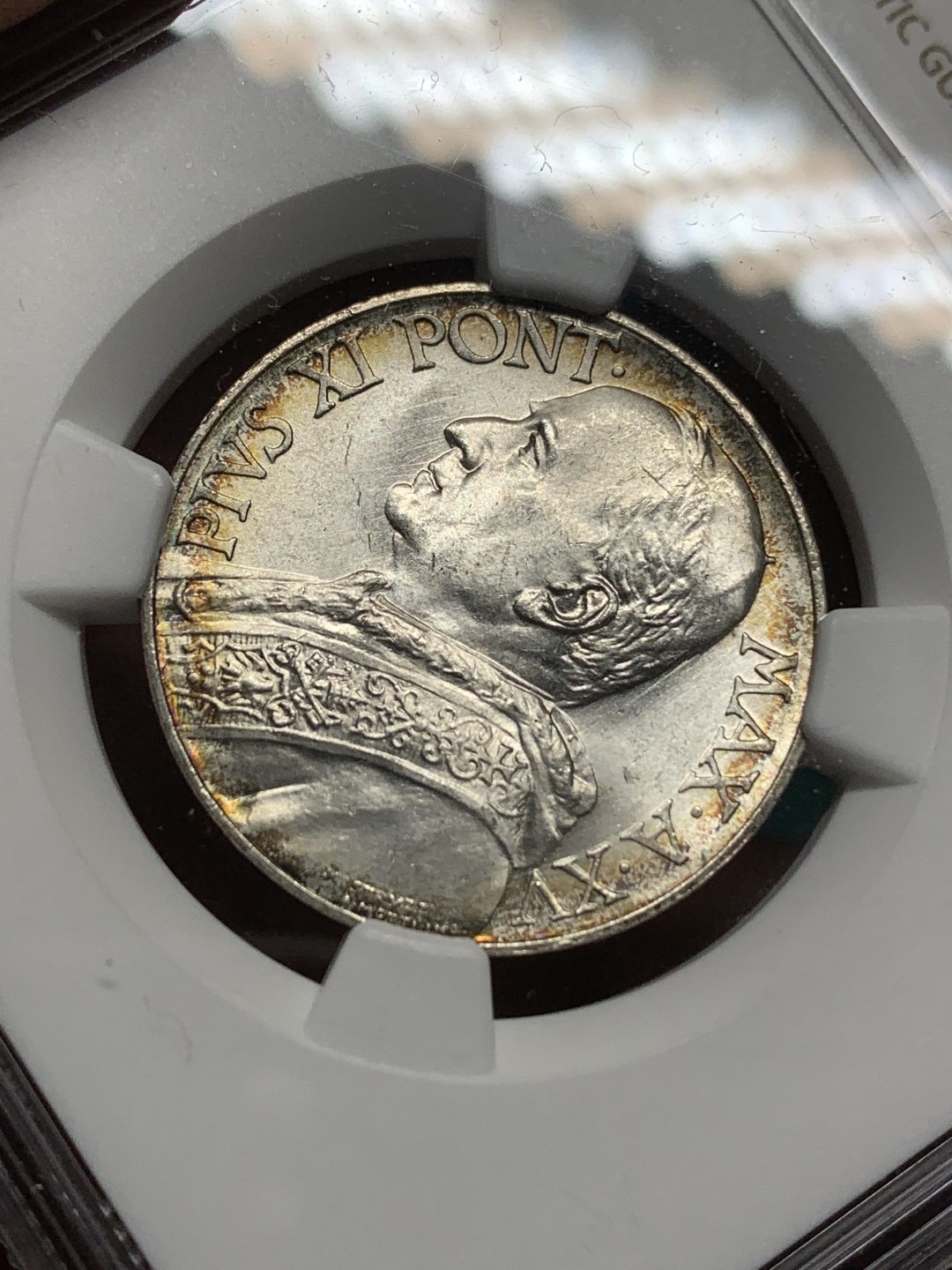 《竞宝斋》第167场-周日，周一，周四 3场 (全场包邮) NGC MS63，梵蒂冈1936年10里拉。梵蒂冈主币，带少许环彩。年底上海评，给分略有保守