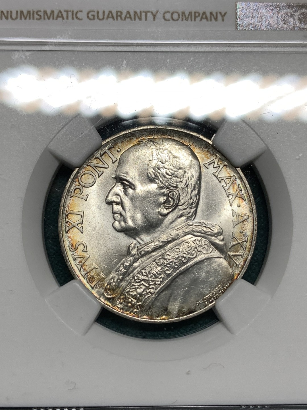 《竞宝斋》第167场-周日，周一，周四 3场 (全场包邮) NGC MS63，梵蒂冈1936年10里拉。梵蒂冈主币，带少许环彩。年底上海评，给分略有保守