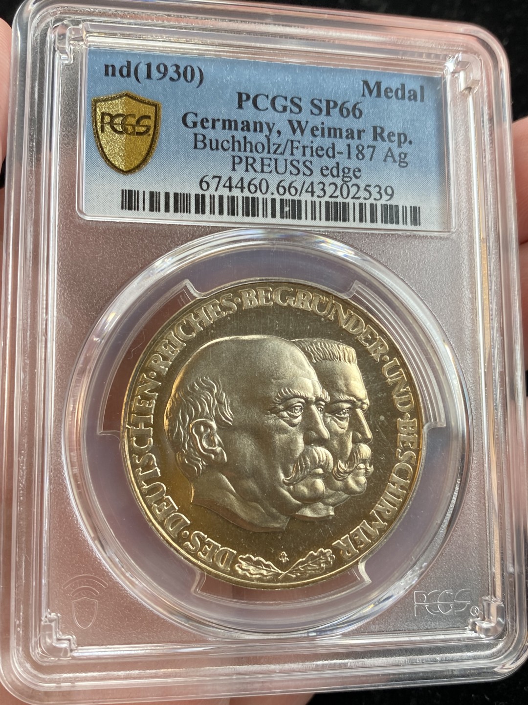 万国钱币拍卖第009期（万国白金之夜） PCGS SP66 1930年魏玛共和国银章开辟者俾斯麦与守卫者兴登堡，背面25个邦徽细节完美，顶级品相，PCGS冠军分，双面高闪金色包浆，一步到位的收藏。