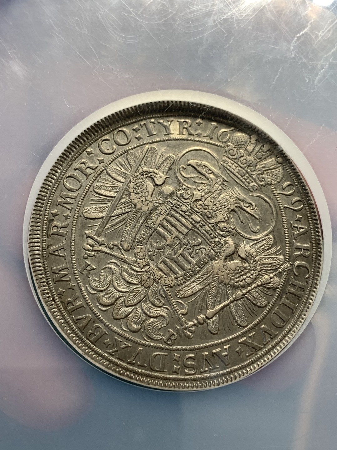 《竞宝斋》第169场-周日，周一2场 (全场包邮) NGC-AU58 神圣罗马帝国 匈牙利 1699 1泰勒 利奥波德大波浪，发丝细节完美，欧洲回流紫罗兰包浆，上海低评，应该是MS的东西