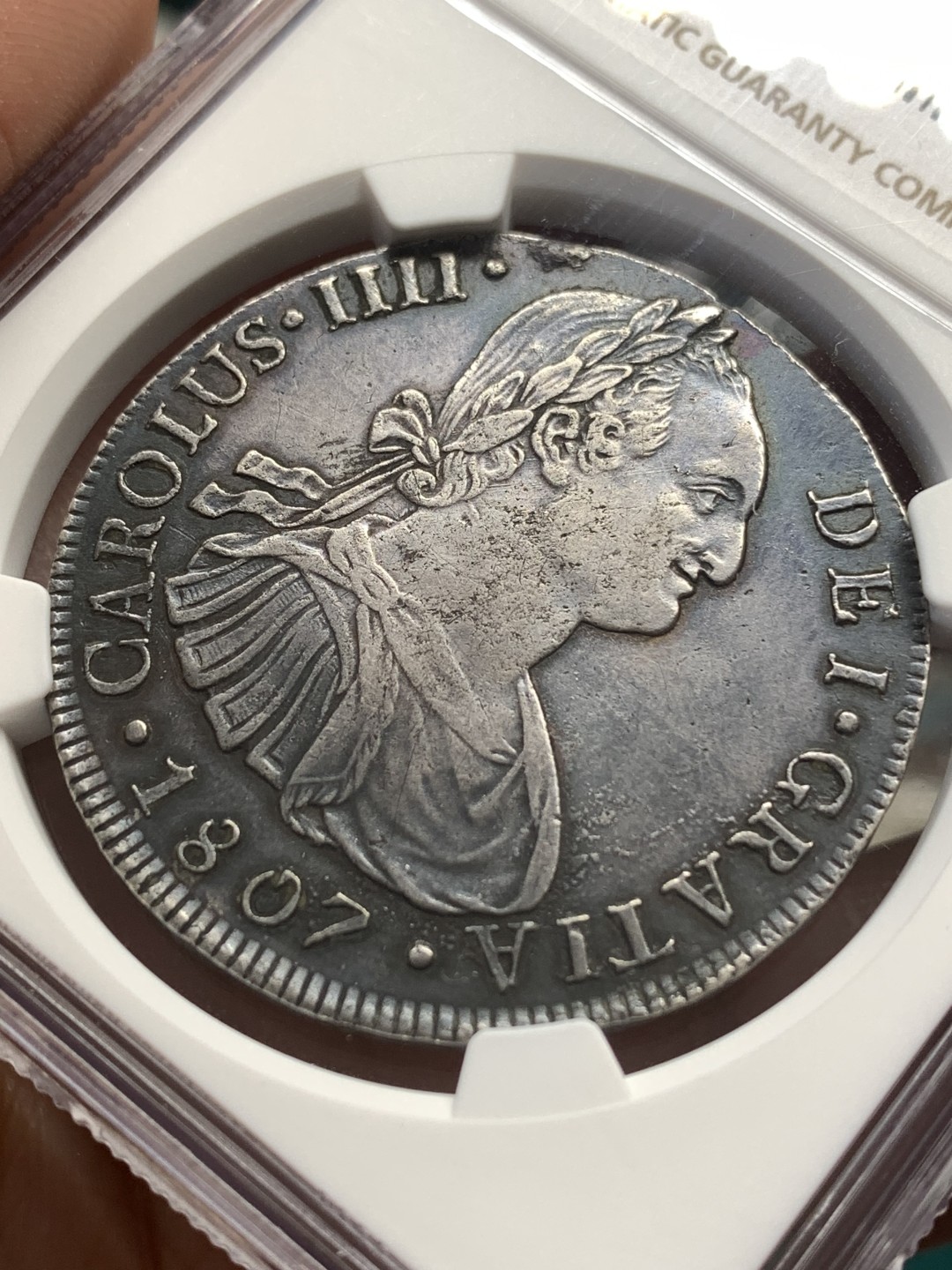 《竞宝斋》第169场-周日，周一2场 (全场包邮) NGC-AUD 秘鲁 1807年卡洛斯四世双柱银币 双面深打 细节很好