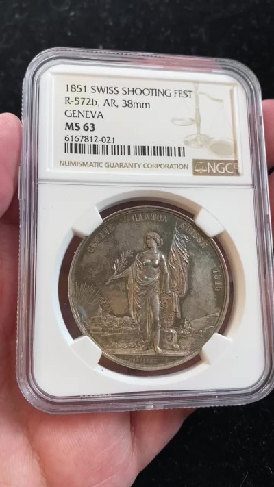 万国钱币拍卖第009期（万国白金之夜） NGC MS63 1851瑞士日内瓦射击节女神银章，原味五彩，镜面底板。