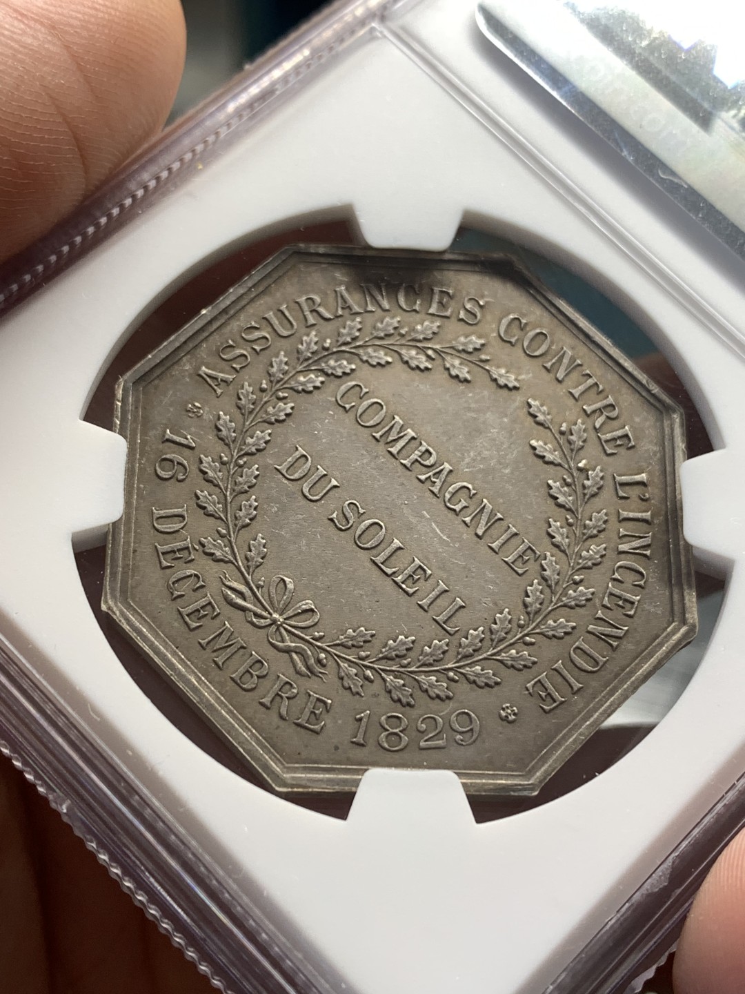 《竞宝斋》第169场-周日，周一2场 (全场包邮) NGC-MS61 法国 1829 太阳保险八角银质代币