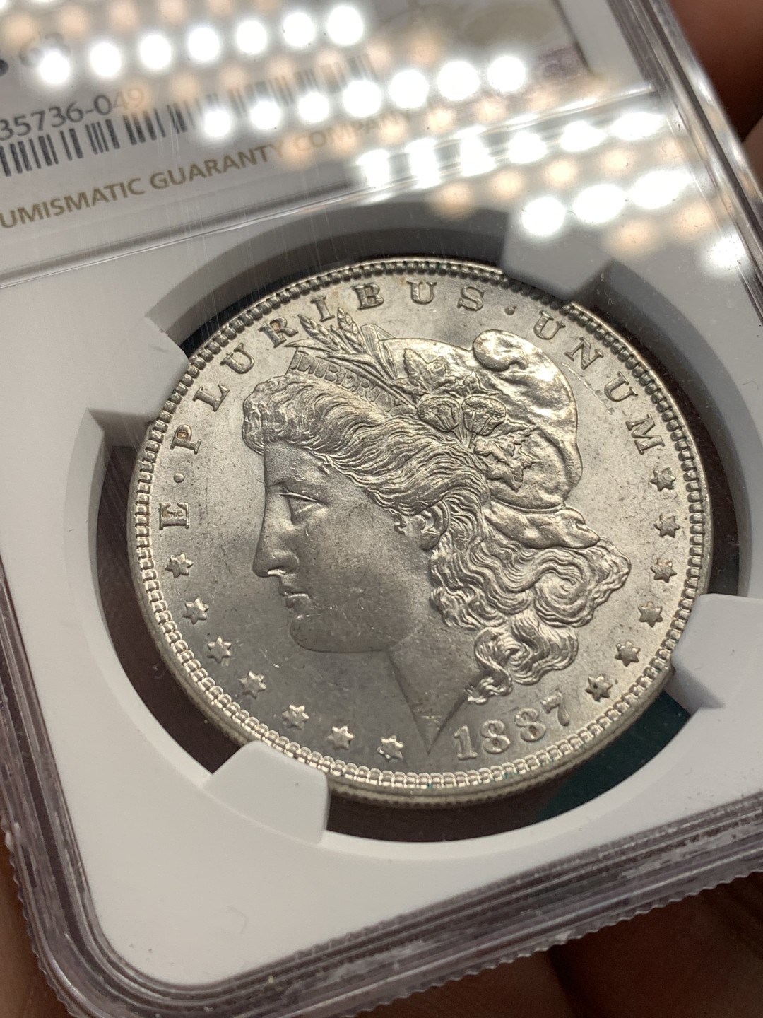 《竞宝斋》第169场-周日，周一2场 (全场包邮) NGC-MS63 美国1887年 摩根一元 原光好品