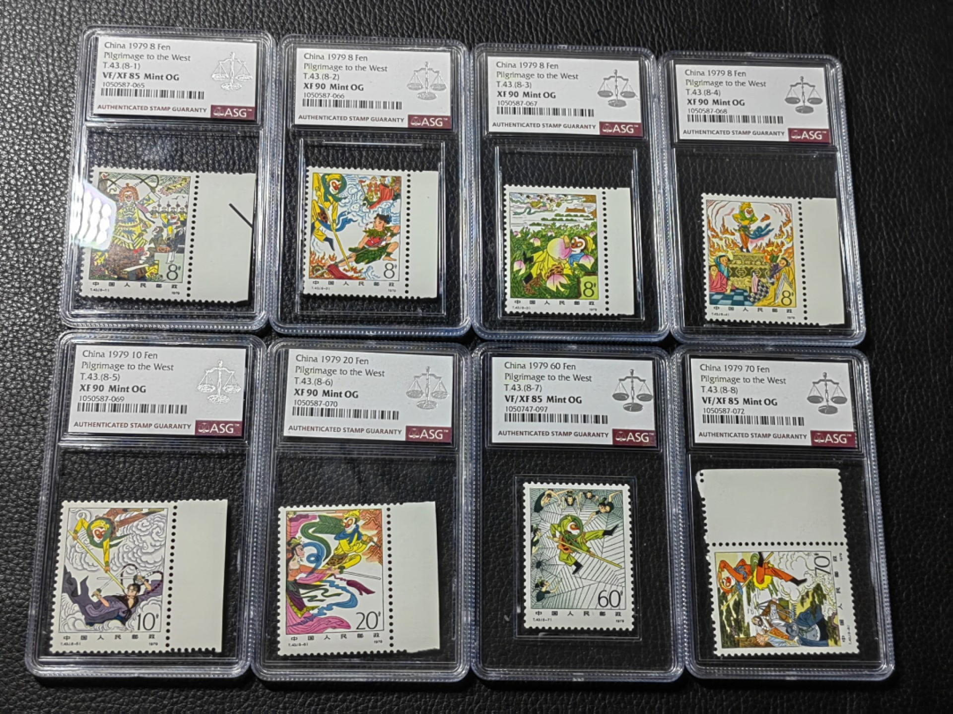 洪涛臻品批发群  精选邮票限时拍卖第二百八十六期 T43西游记新全  ASG评级，3枚85，5枚90，均OG，JT热门精品，最严格时期出分，大套票混分超高性价比，四大名著永恒的经典，一手出分，壳子完好无划痕，藏家首选，喜欢不要错过