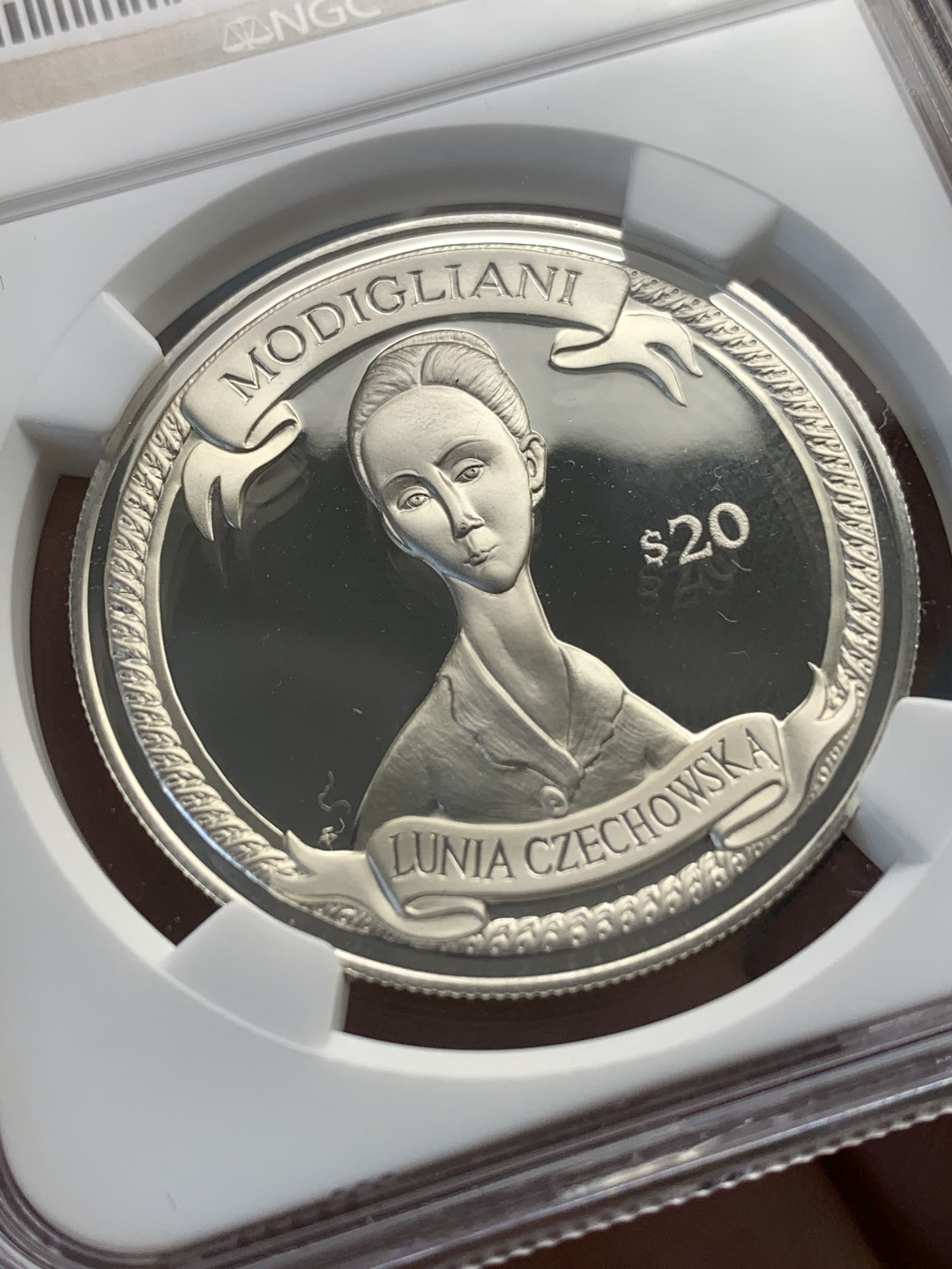 《竞宝斋》第172场-周日，周一2场 (全场包邮) NGC PF69UC 2000年英属维京群岛发行-意大利国宝级画家莫迪利亚尼名画20$纪念银币 唯一冠军分，国内罕见的品种。