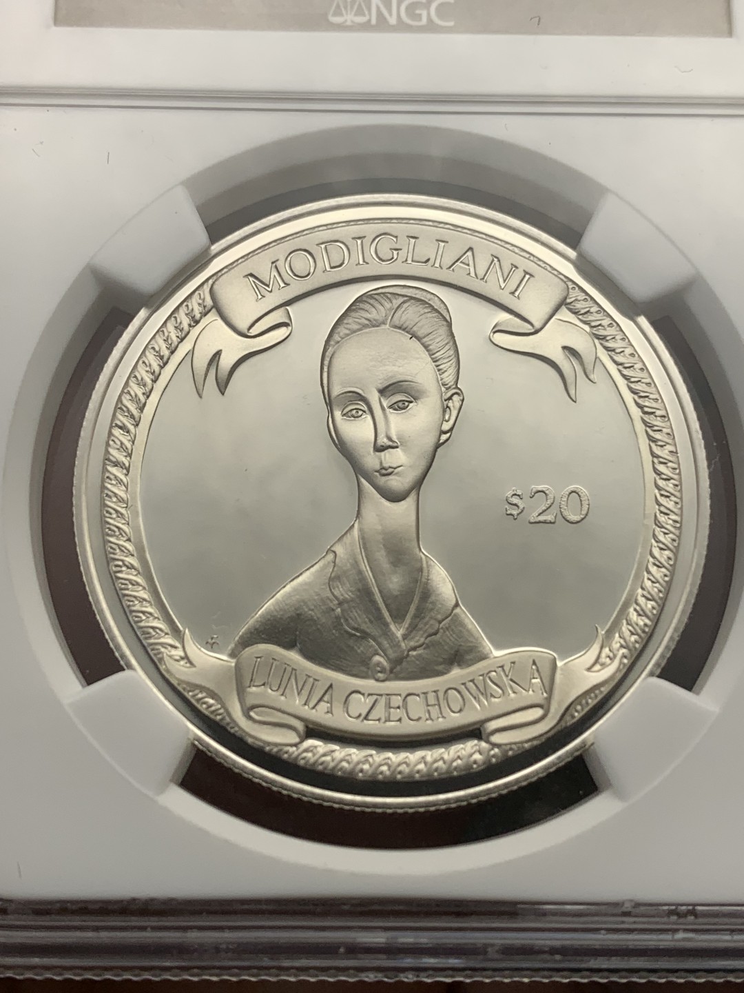 《竞宝斋》第172场-周日，周一2场 (全场包邮) NGC PF69UC 2000年英属维京群岛发行-意大利国宝级画家莫迪利亚尼名画20$纪念银币 唯一冠军分，国内罕见的品种。
