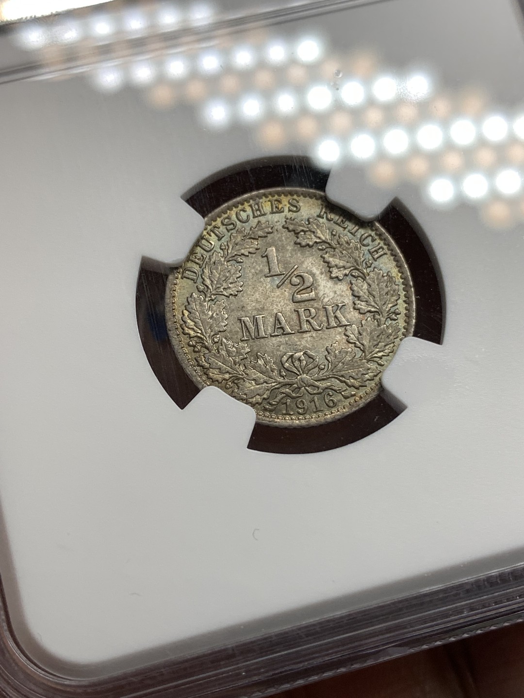 《竞宝斋》第173场-周日，周一2场 (全场包邮) NGC MS65 德国 1916年 1/2马克 银币 双面五彩包浆 非常不错