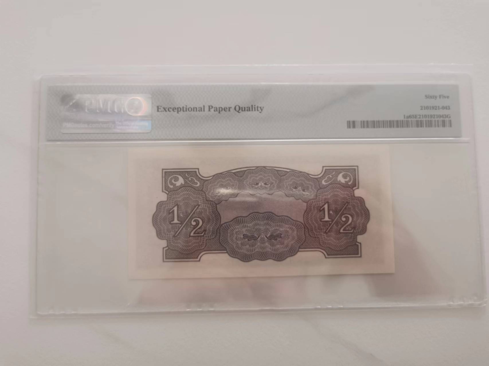 243.【鲸贝乐淘★两拍包邮】三字经·第“首孝悌，次见闻”号拍卖 【日占大洋洲军票】1942年1/2先令，PMG65E