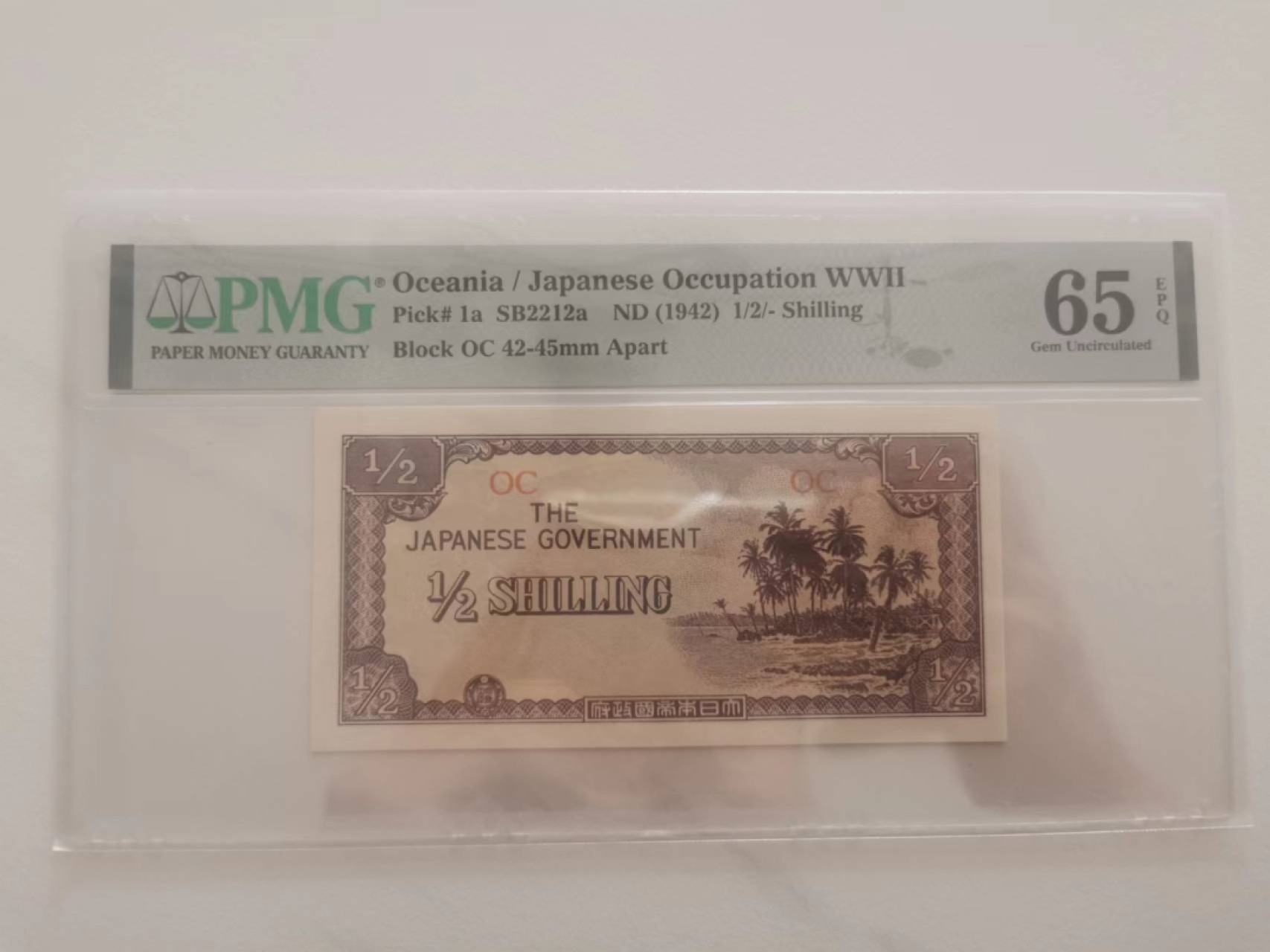 243.【鲸贝乐淘★两拍包邮】三字经·第“首孝悌，次见闻”号拍卖 【日占大洋洲军票】1942年1/2先令，PMG65E