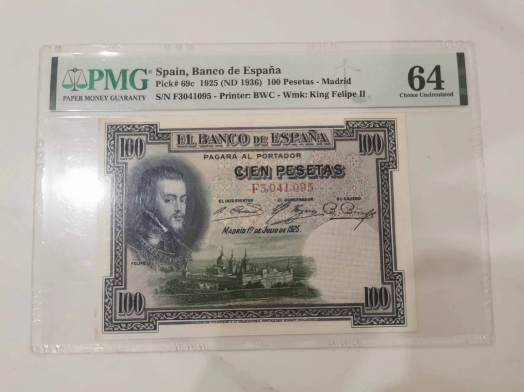 243.【鲸贝乐淘★两拍包邮】三字经·第“首孝悌，次见闻”号拍卖 【西班牙🇪🇸】1925年100元，百年老钞，PMG64分，瑕疵如图