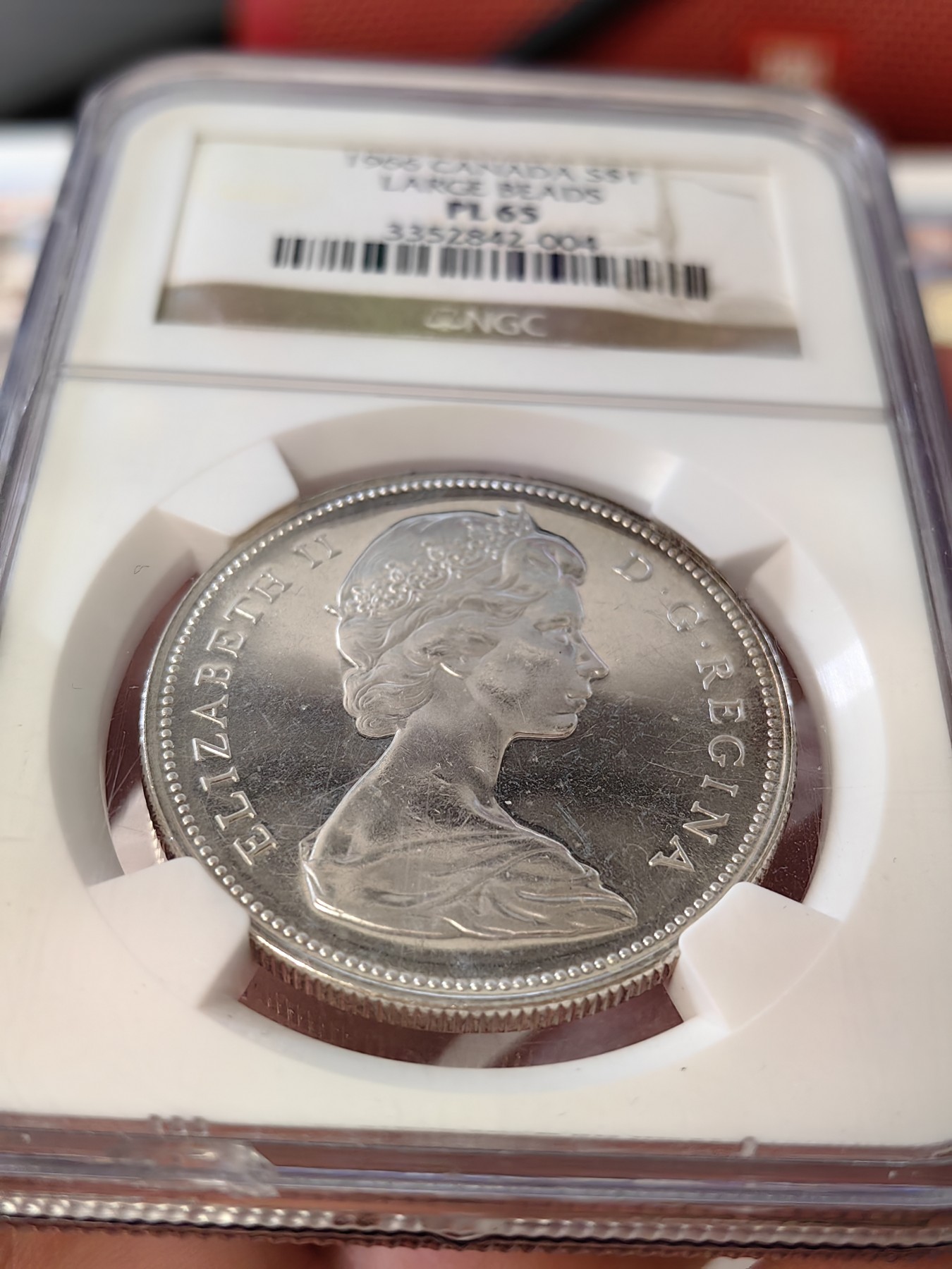 橡树集藏-006场 海纳百川 ngc-pl65 1966年加拿大划船1美元大银币 类精制工艺 光泽四溢 大圆珠版本 中年伊伊头像 端庄典雅