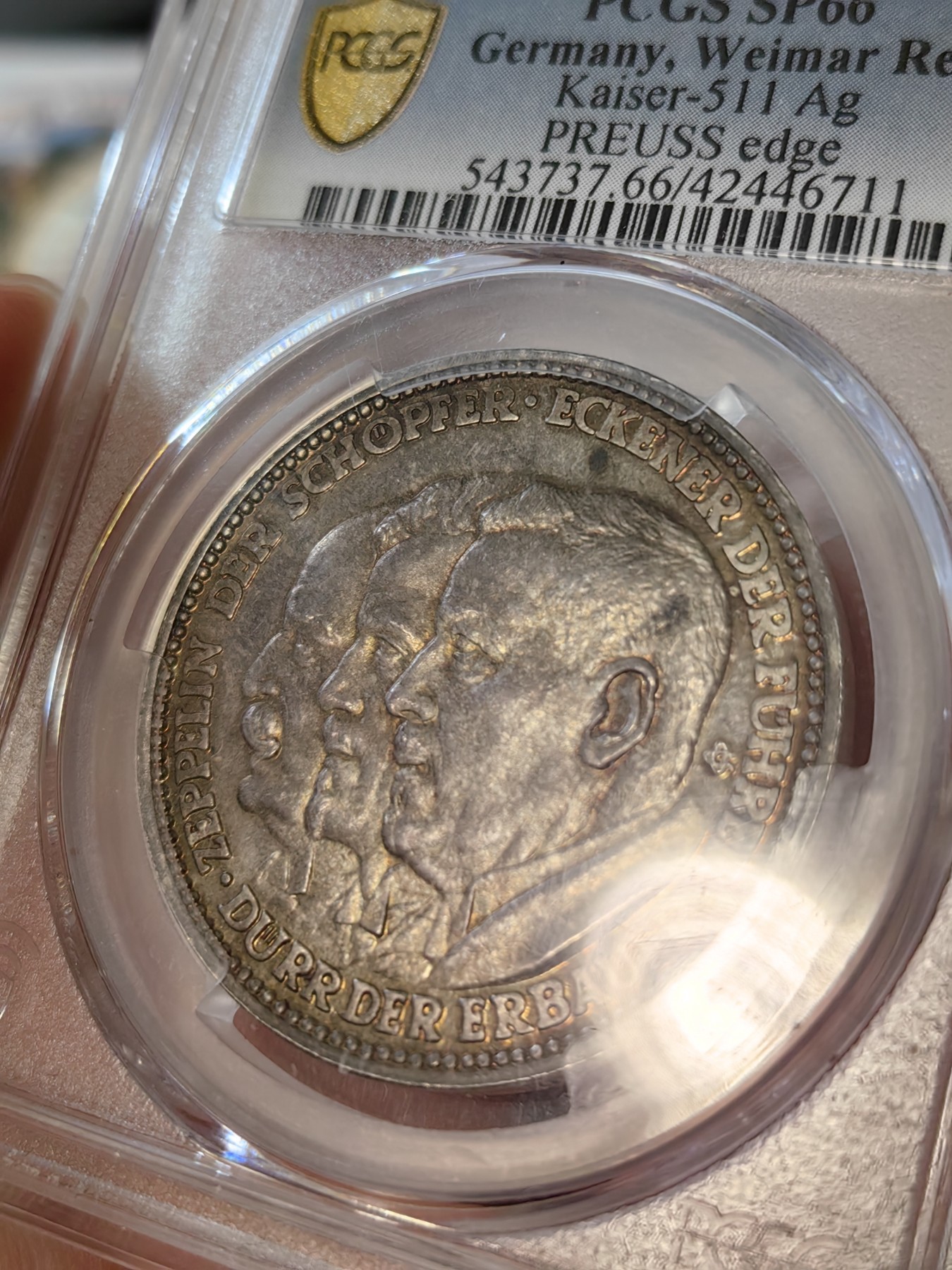 橡树集藏-006场 海纳百川 pcgs-sp66 (Kaiser-511、加字版),魏玛共和国1929，齐拍林飞艇环游世界纪念银章，顶级高分，五彩镜面，背面为标注“洛杉矶”“东京”等地名的高浮雕地球图案。