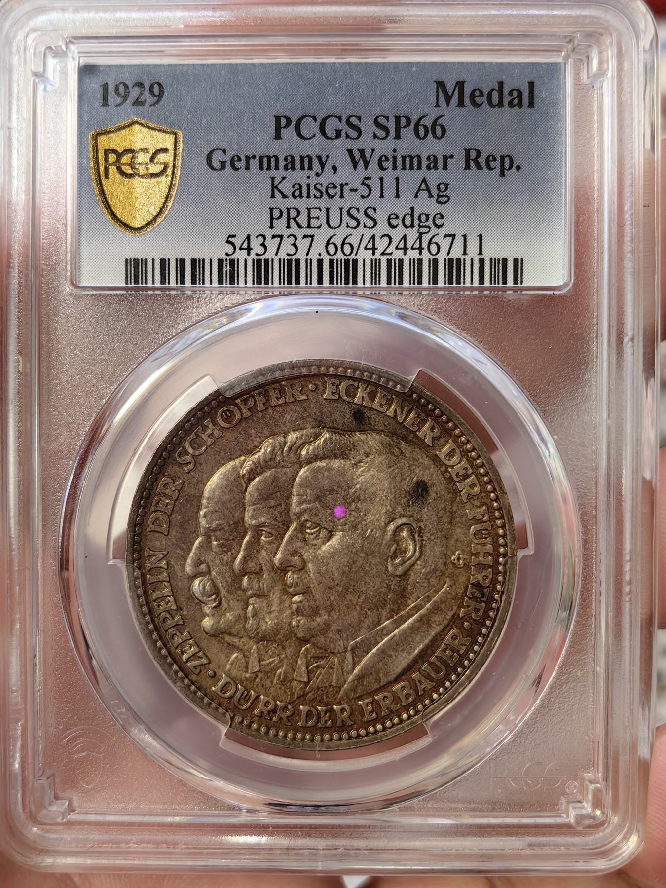橡树集藏-006场 海纳百川 pcgs-sp66 (Kaiser-511、加字版),魏玛共和国1929，齐拍林飞艇环游世界纪念银章，顶级高分，五彩镜面，背面为标注“洛杉矶”“东京”等地名的高浮雕地球图案。