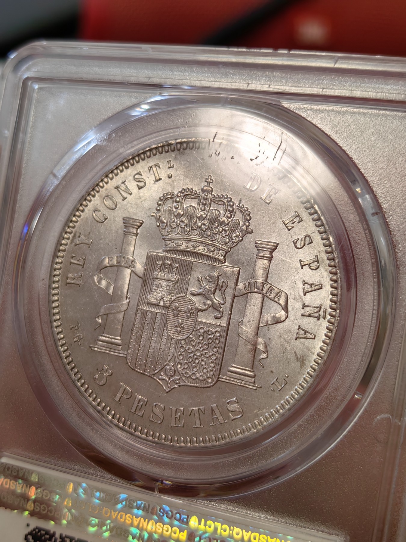 橡树集藏-006场 海纳百川 pcgs-Ms64 1893年西班牙5比塞塔大银币 阿方索十三世 爆炸头男童   数据库唯一冠军分，高分顶级品相，双面pl感十足，镜面感强烈。底板完美打制佳，双面深打，浮雕完美，头发丝丝入扣，实物绝美。车轮流银强霜光，西属大热门。可爱微笑男童，肥嘟嘟小脸。