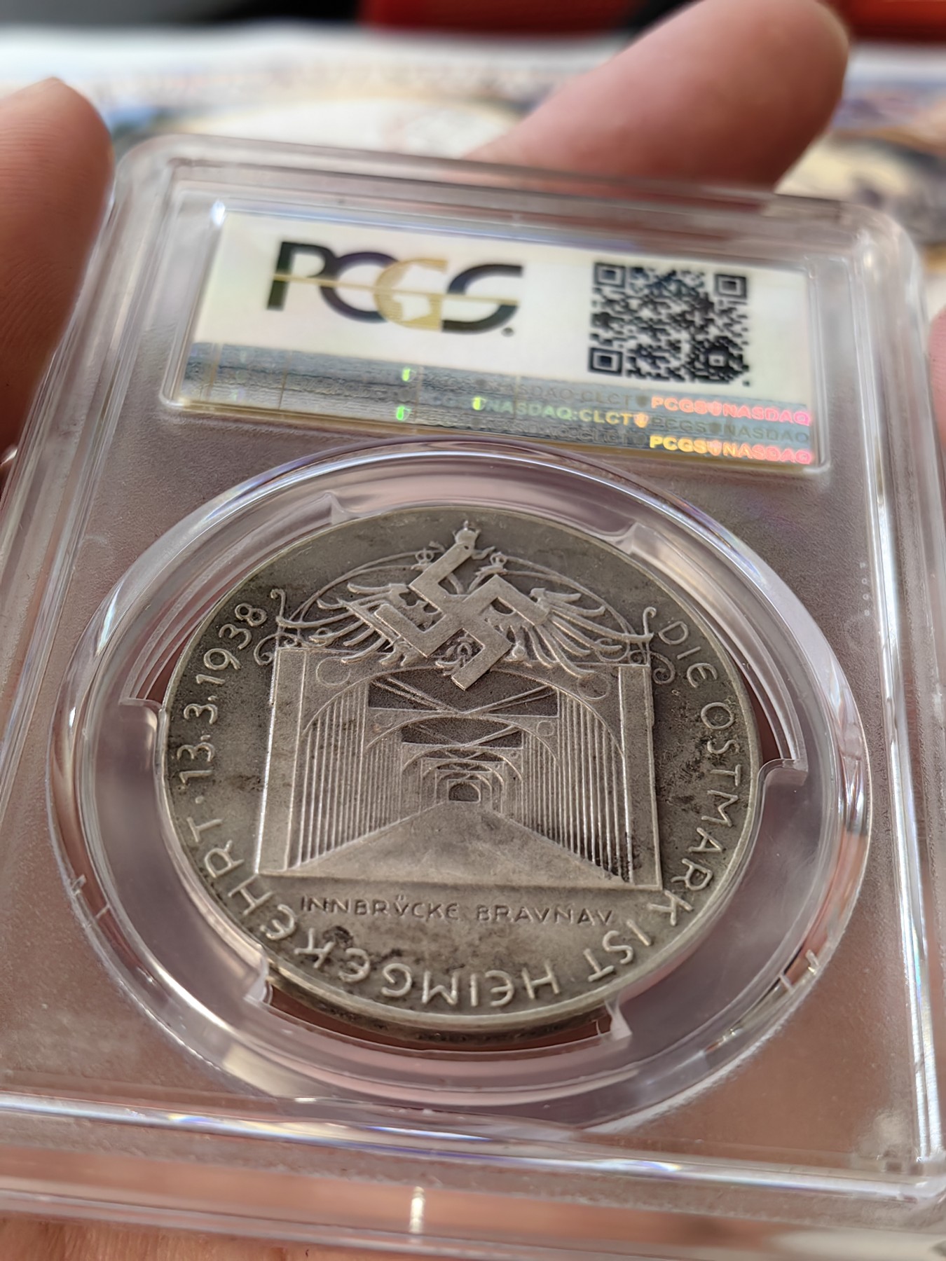 橡树集藏-006场 海纳百川 pcgs-sp62 1938年德国入侵吞并奥地利纪念银章！ 元首名誉品种！数量极少！ 德军在元首的命令下，通过元首家乡的大桥，占领奥地利。非常有象征意义的军事行动。德奥合并，德意志重归一统，第三帝国自此诞生。