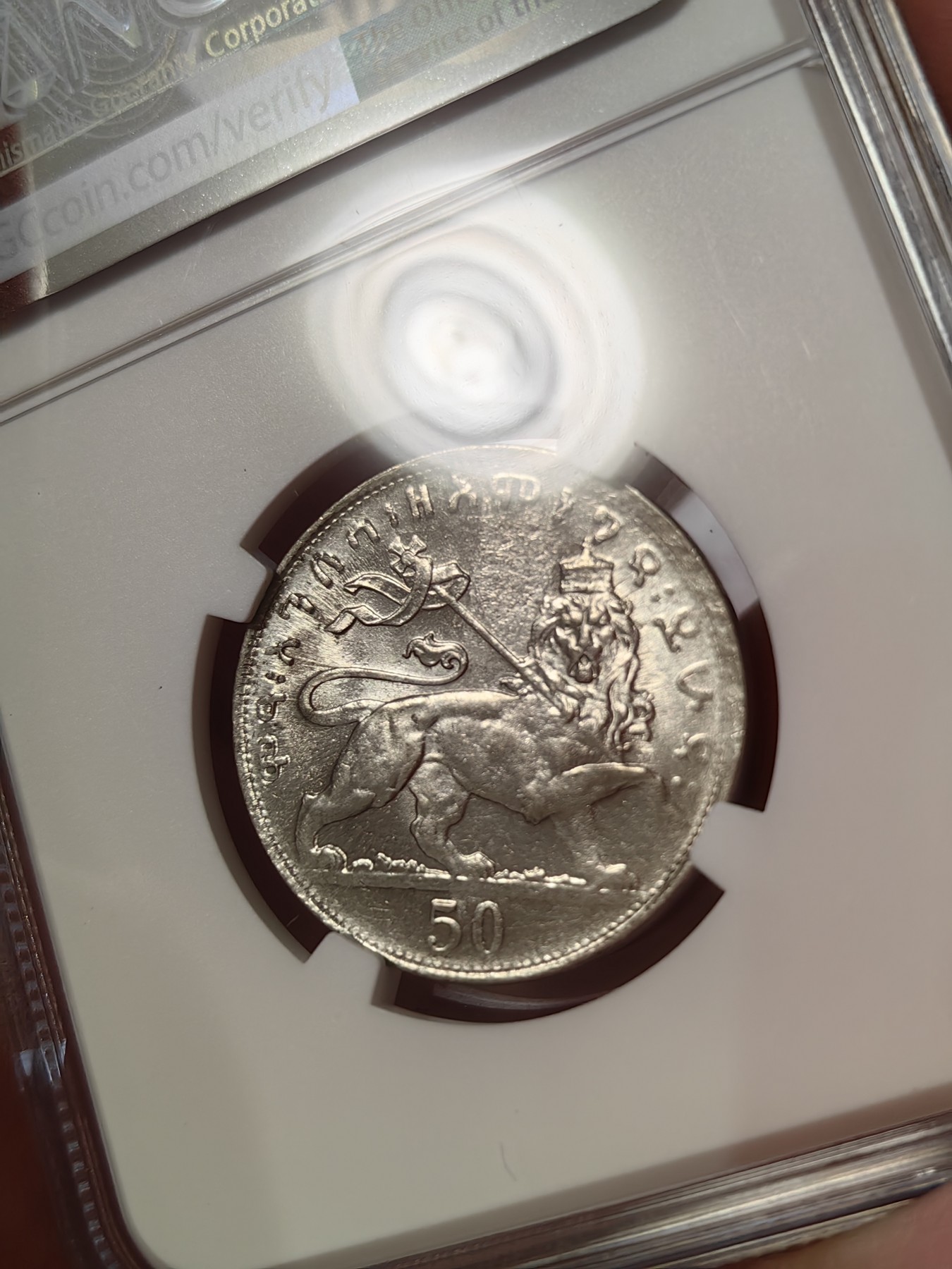 橡树集藏-006场 海纳百川 ngc-Ms64 1931年埃塞俄比亚50马托雅思 只发行了一年 高分好状态 正面是头戴王冠的大胡子非洲国王 细节极佳 背面是右扛旗雄狮 大热门银币同种设计 稀有品种 亚军分 上面只有一枚更高分