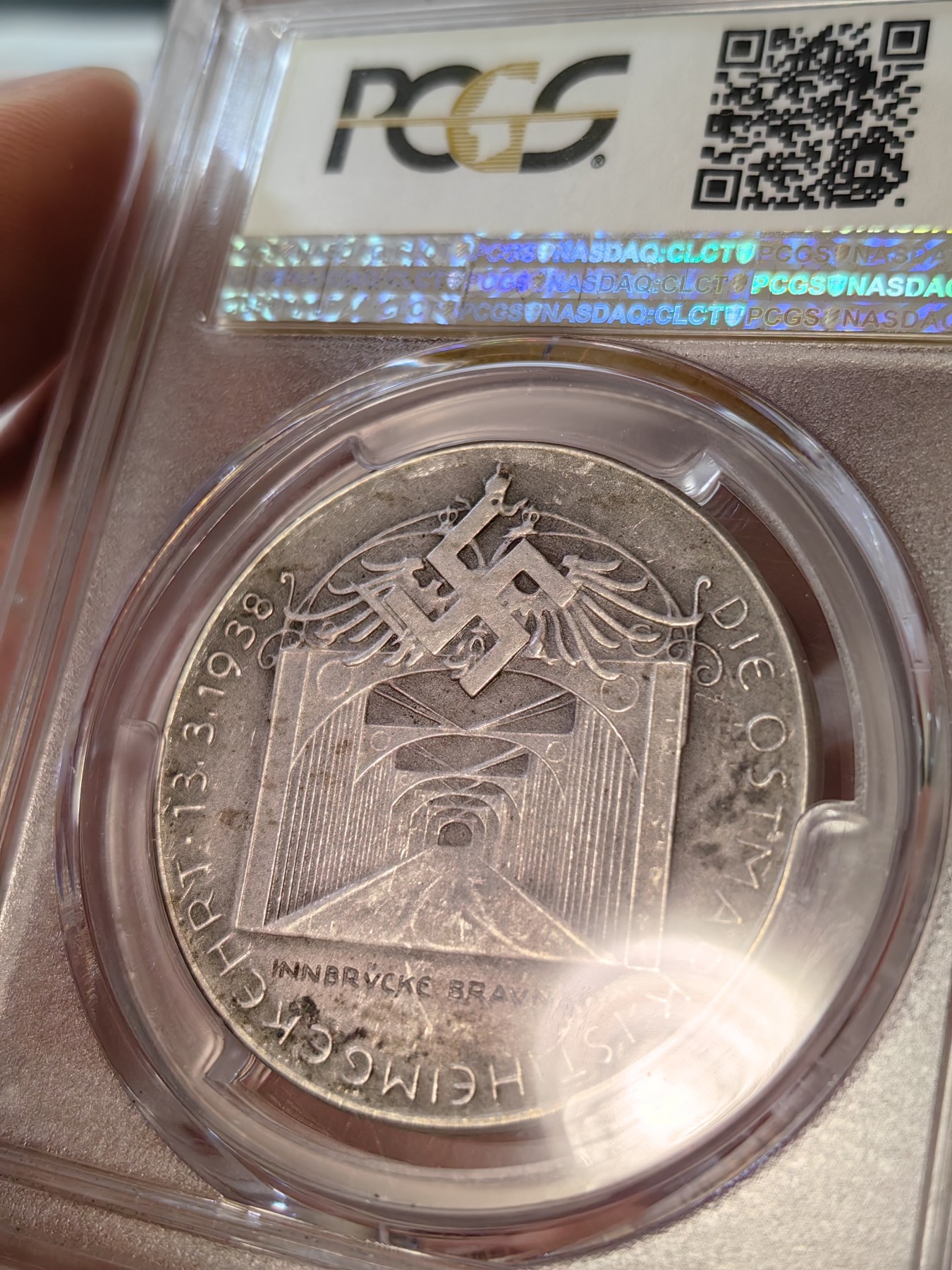 橡树集藏-006场 海纳百川 pcgs-sp62 1938年德国入侵吞并奥地利纪念银章！ 元首名誉品种！数量极少！ 德军在元首的命令下，通过元首家乡的大桥，占领奥地利。非常有象征意义的军事行动。德奥合并，德意志重归一统，第三帝国自此诞生。