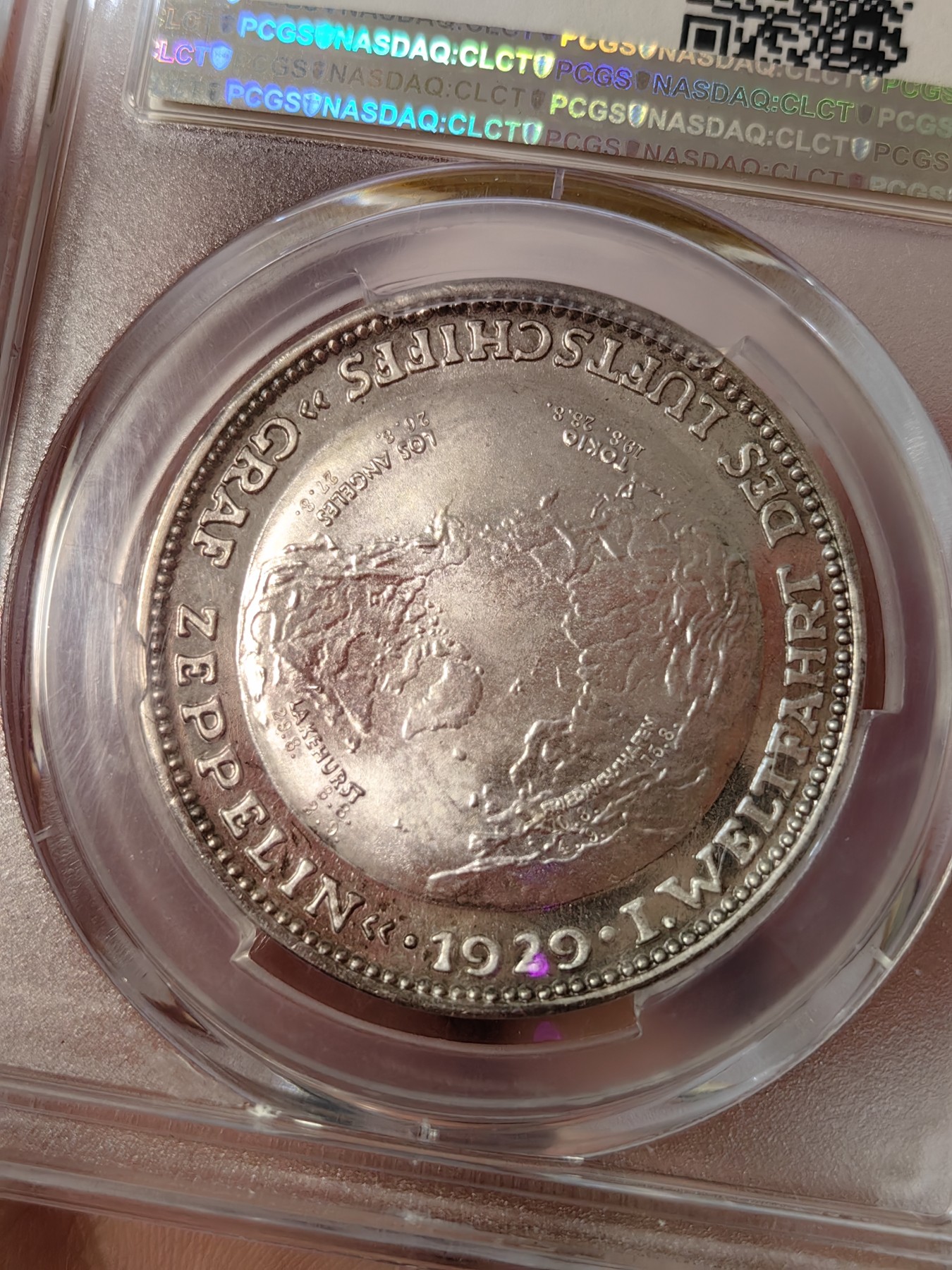 橡树集藏-006场 海纳百川 pcgs-sp66 1929年 (Kaiser-510),齐拍林飞艇环游世界，顶级高分，镜面底板，背面为标注“洛杉矶”“东京”等地名的高浮雕地球图案。