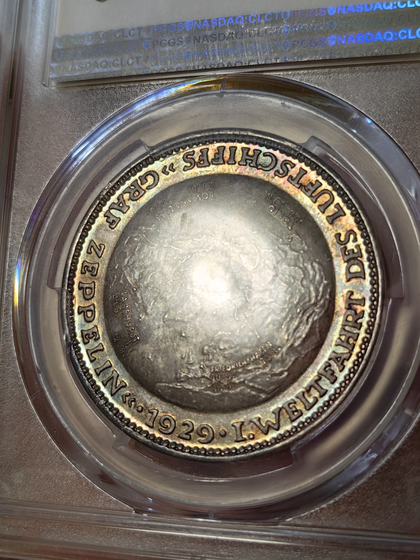 橡树集藏-006场 海纳百川 pcgs-sp66 (Kaiser-511、加字版),魏玛共和国1929，齐拍林飞艇环游世界纪念银章，顶级高分，五彩镜面，背面为标注“洛杉矶”“东京”等地名的高浮雕地球图案。