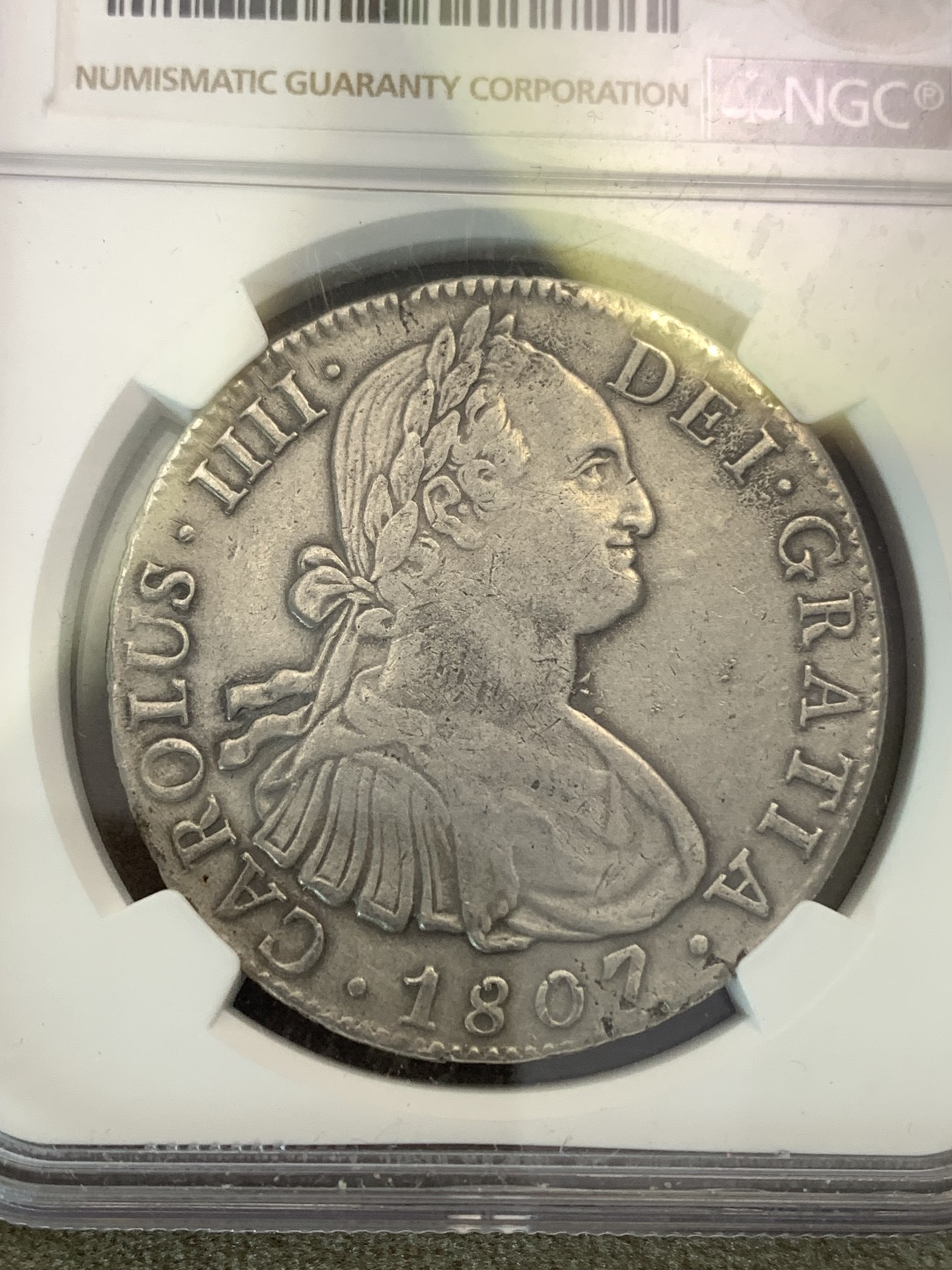 《竞宝斋》第180场-周日，周一2场 (全场包邮) NGC–XFD 墨西哥 1807年卡洛斯四世双柱银币 背面有焊接痕迹