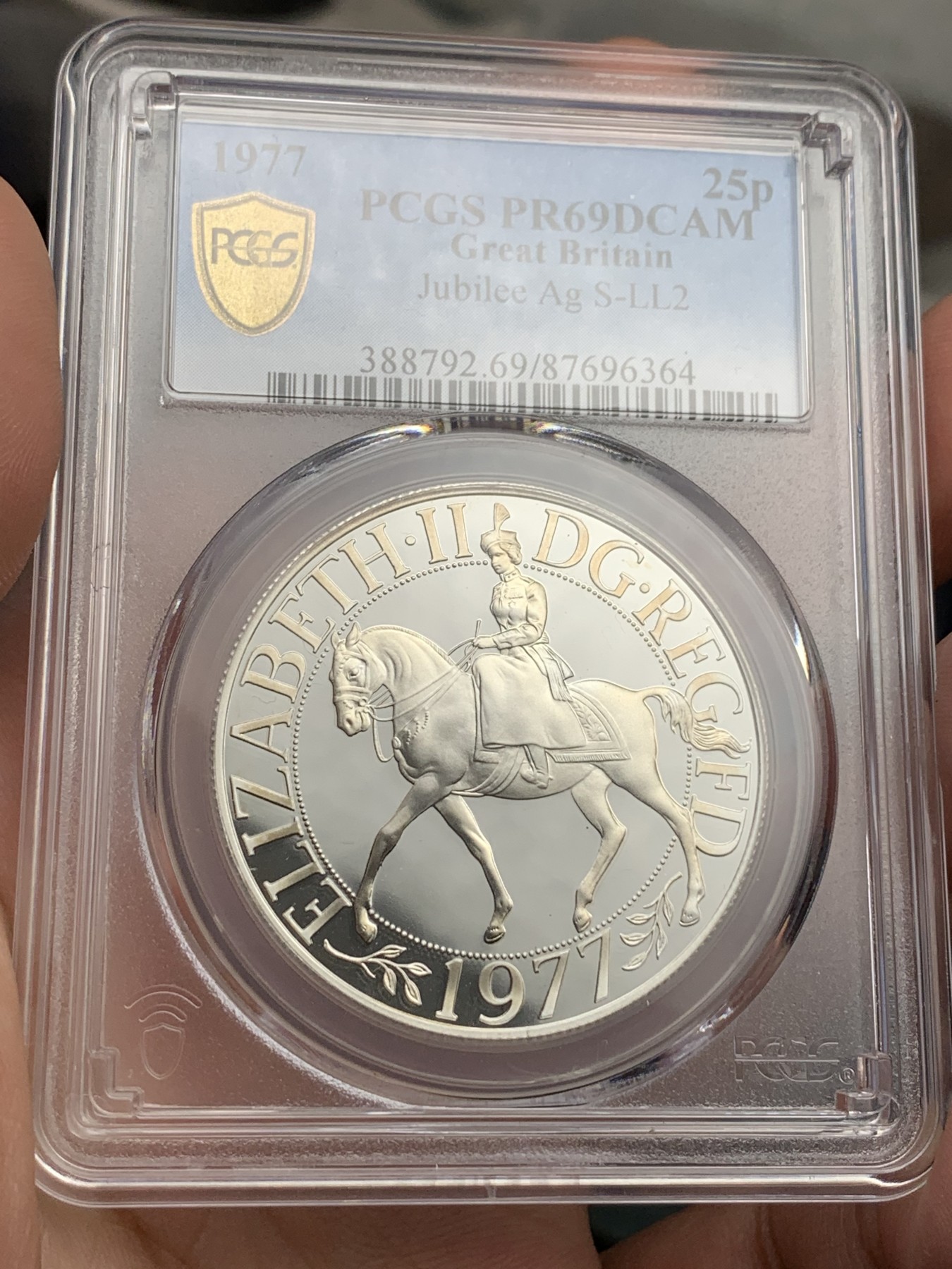 《竞宝斋》第180场-周日，周一2场 (全场包邮) PCGS-PR69DC 英国1977年伊丽莎白二世禧年精制25便士（克朗型）银币,69已经很难了，带原盒。