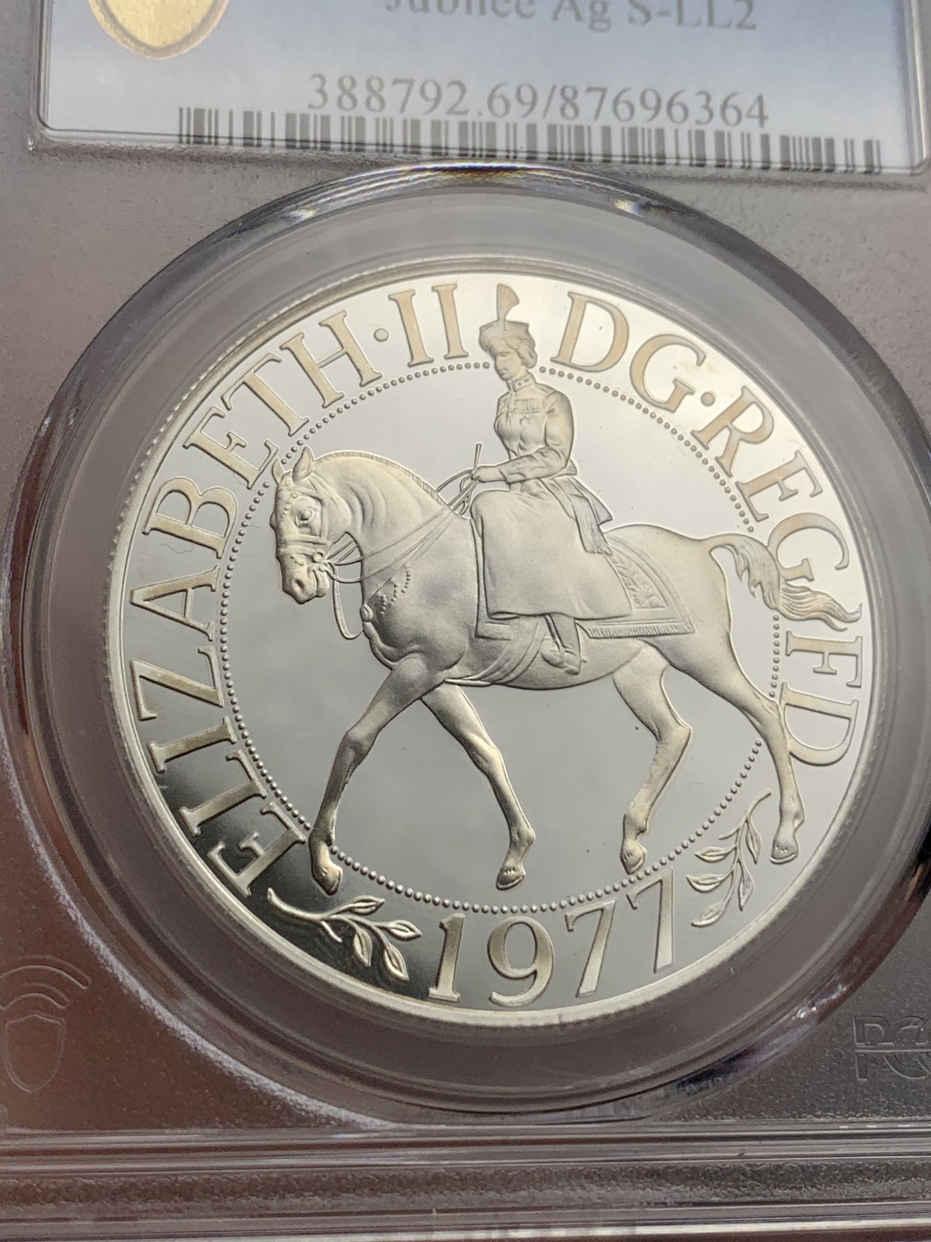 《竞宝斋》第180场-周日，周一2场 (全场包邮) PCGS-PR69DC 英国1977年伊丽莎白二世禧年精制25便士（克朗型）银币,69已经很难了，带原盒。