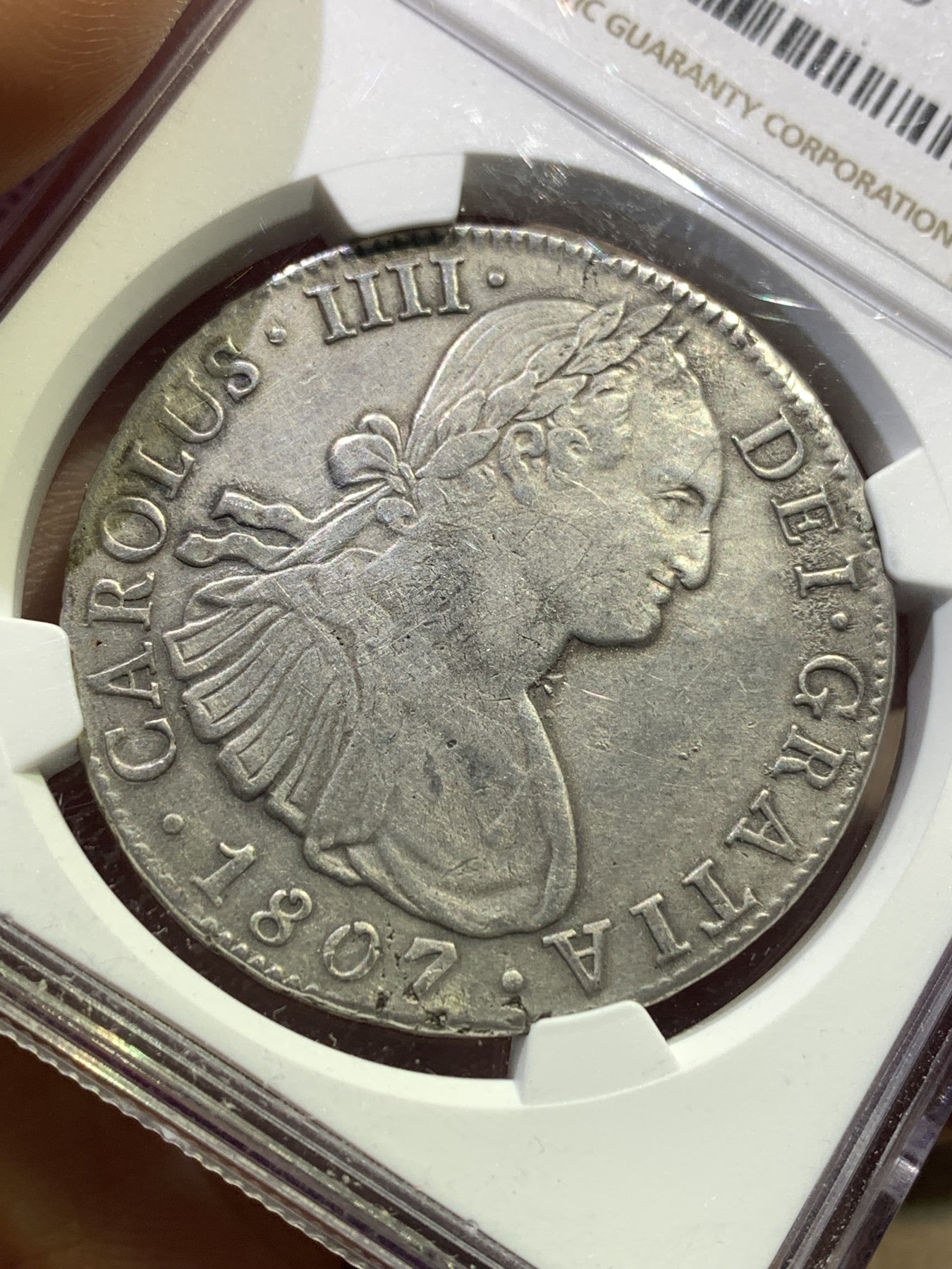 《竞宝斋》第180场-周日，周一2场 (全场包邮) NGC–XFD 墨西哥 1807年卡洛斯四世双柱银币 背面有焊接痕迹