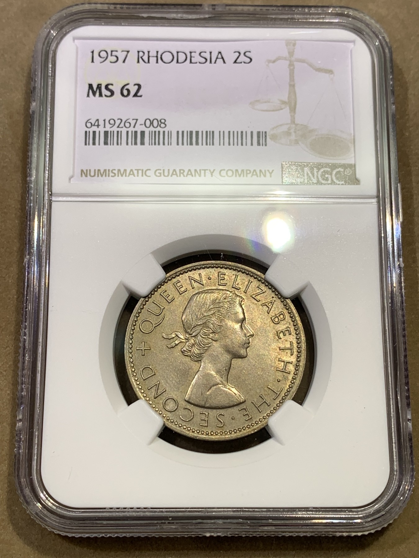 《竞宝斋》第180场-周日，周一2场 (全场包邮) NGC-MS62 1957年罗德西亚1弗洛林，不多见的品种，仅发行3个年份。伊丽莎白女王年轻头像，雄鹰攫鱼翱翔，设计独特。