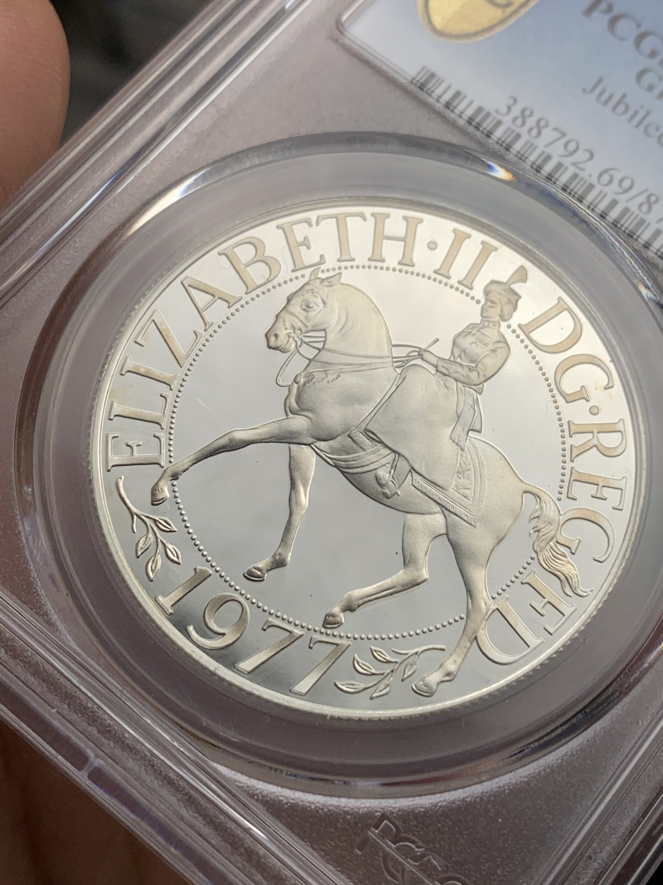 《竞宝斋》第180场-周日，周一2场 (全场包邮) PCGS-PR69DC 英国1977年伊丽莎白二世禧年精制25便士（克朗型）银币,69已经很难了，带原盒。