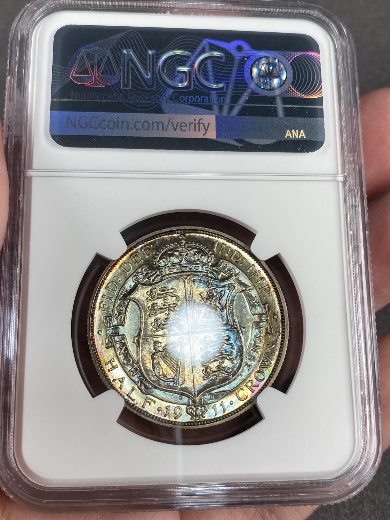 万国钱币拍卖第012期（视频直播专场） NGC PF65 1911年英国乔治五世精制半克朗，超强镜面，绝美包浆，顶级品相。