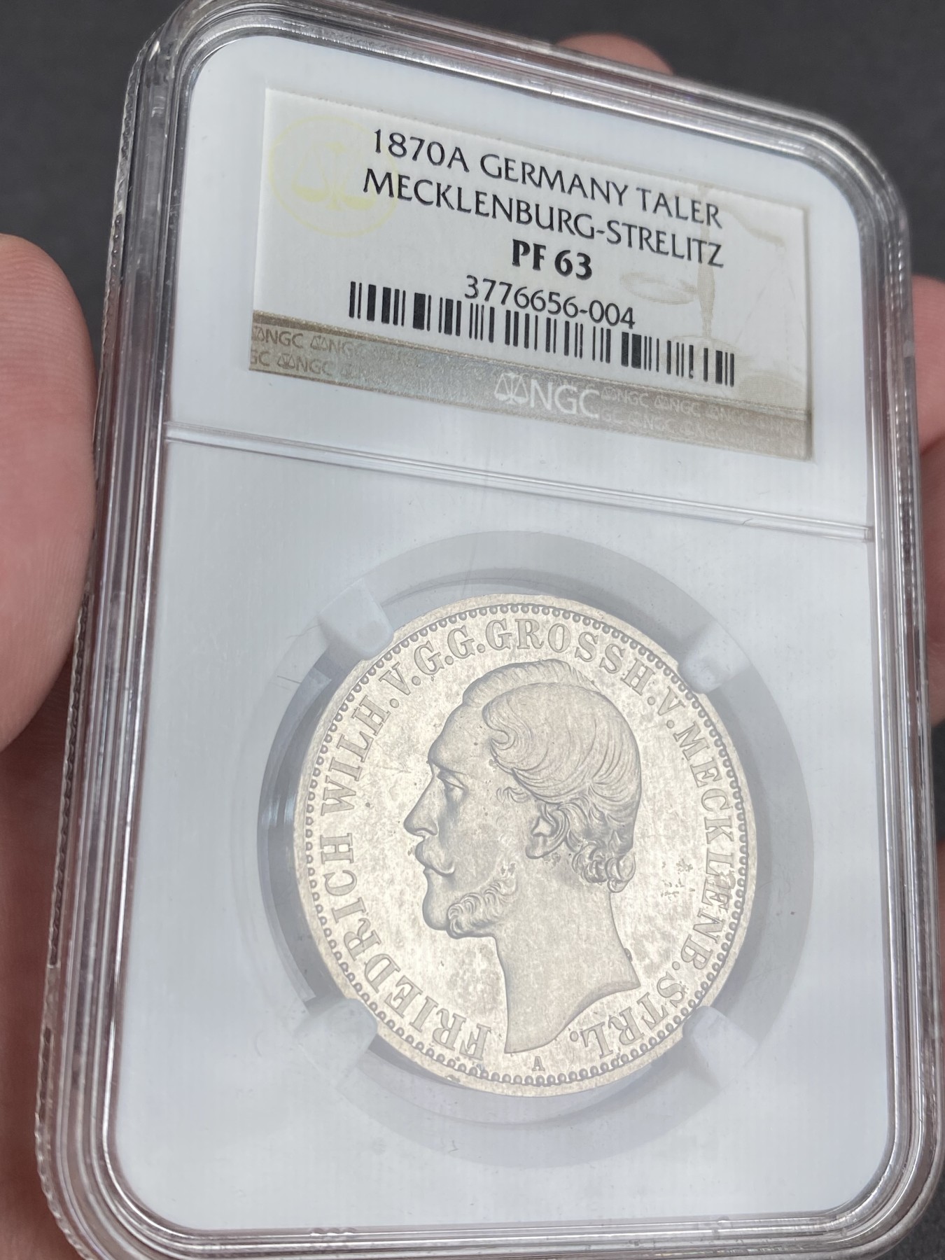 万国钱币拍卖第012期（视频直播专场） NGC PF63 1870年德国梅克伦堡精制1泰勒，加上普制的发行量只有5万枚，精制小邦难度可想而知，十年前ha拍卖原物，当年成交价就已经过800美金。