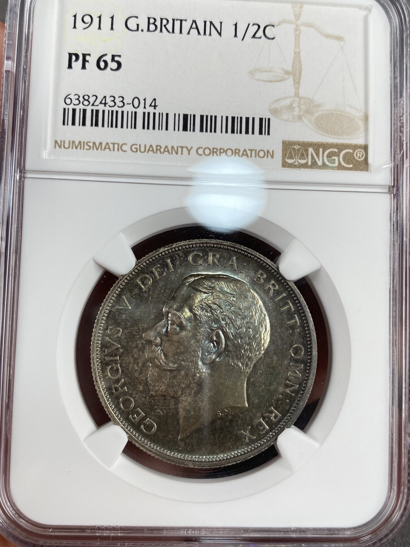 万国钱币拍卖第012期（视频直播专场） NGC PF65 1911年英国乔治五世精制半克朗，超强镜面，绝美包浆，顶级品相。