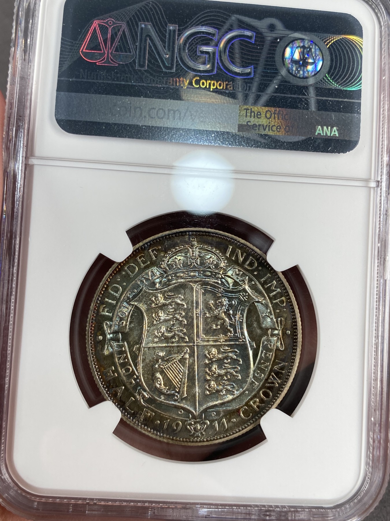 万国钱币拍卖第012期（视频直播专场） NGC PF65 1911年英国乔治五世精制半克朗，超强镜面，绝美包浆，顶级品相。