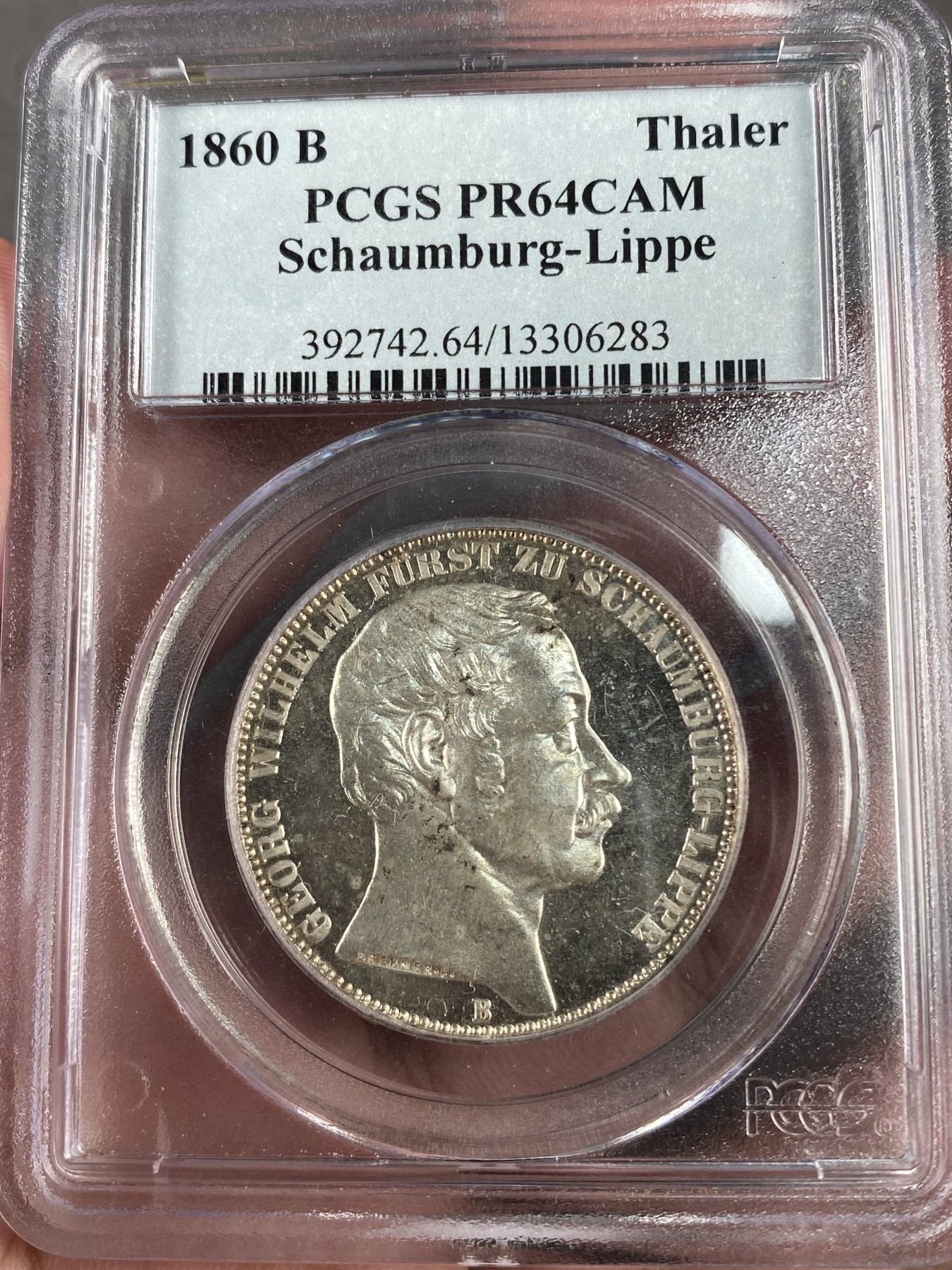 万国钱币拍卖第012期（视频直播专场） PCGS PR64CAM 1860德国绍姆堡利普精制天使泰勒，连同普制的发行量只有8000多枚，精制可以说是凤毛麟角，比1865天使泰勒精制少见很多，镜面凝霜感强烈，一眼区分，pc唯一冠军分，下面只有一枚62，难得老盒配置高清大图。