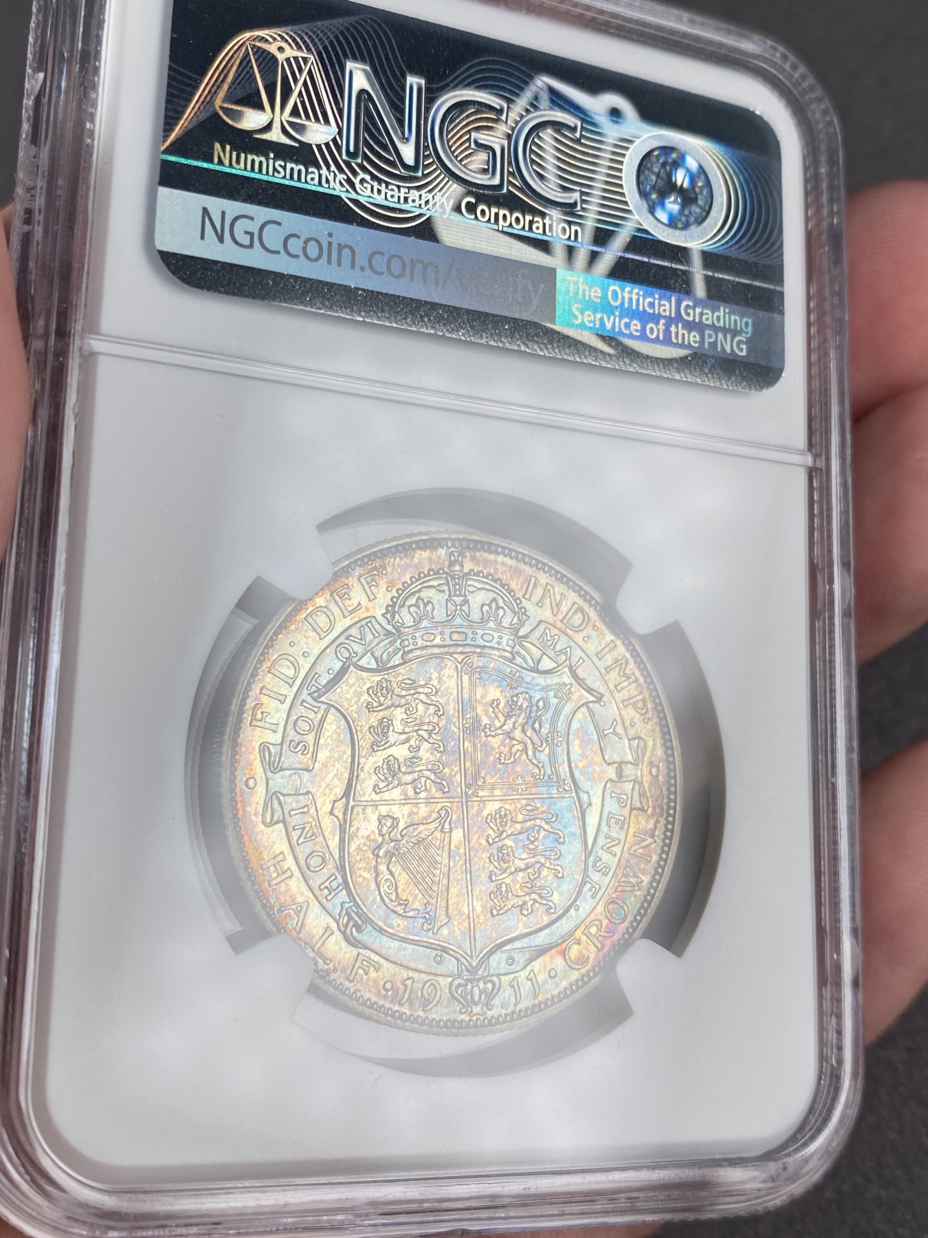 万国钱币拍卖第012期（视频直播专场） NGC PF65 1911年英国乔治五世精制半克朗，超强镜面，绝美包浆，顶级品相。