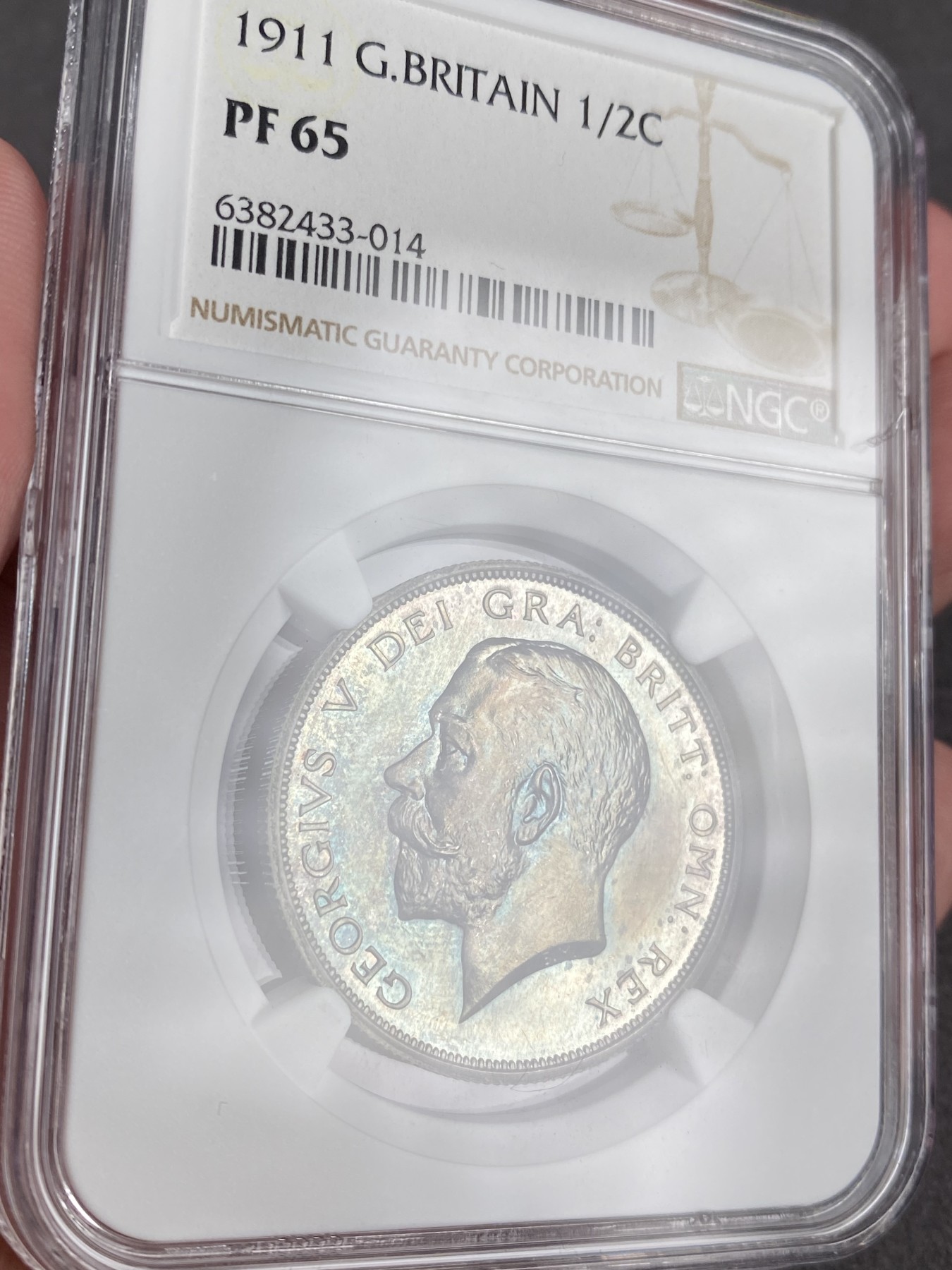 万国钱币拍卖第012期（视频直播专场） NGC PF65 1911年英国乔治五世精制半克朗，超强镜面，绝美包浆，顶级品相。