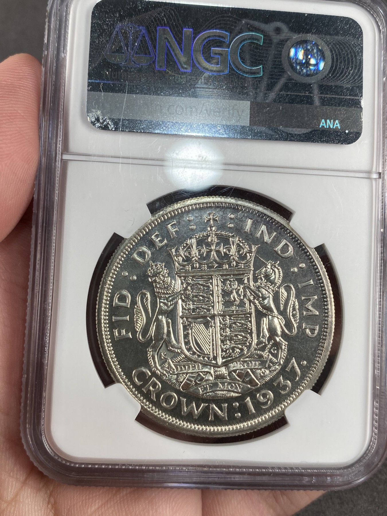 万国钱币拍卖第012期（视频直播专场） NGC PF65 英国1937年乔治六世登基纪念1克朗银币，高分精制镜面。