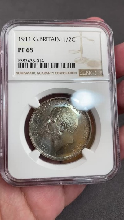 万国钱币拍卖第012期（视频直播专场） NGC PF65 1911年英国乔治五世精制半克朗，超强镜面，绝美包浆，顶级品相。