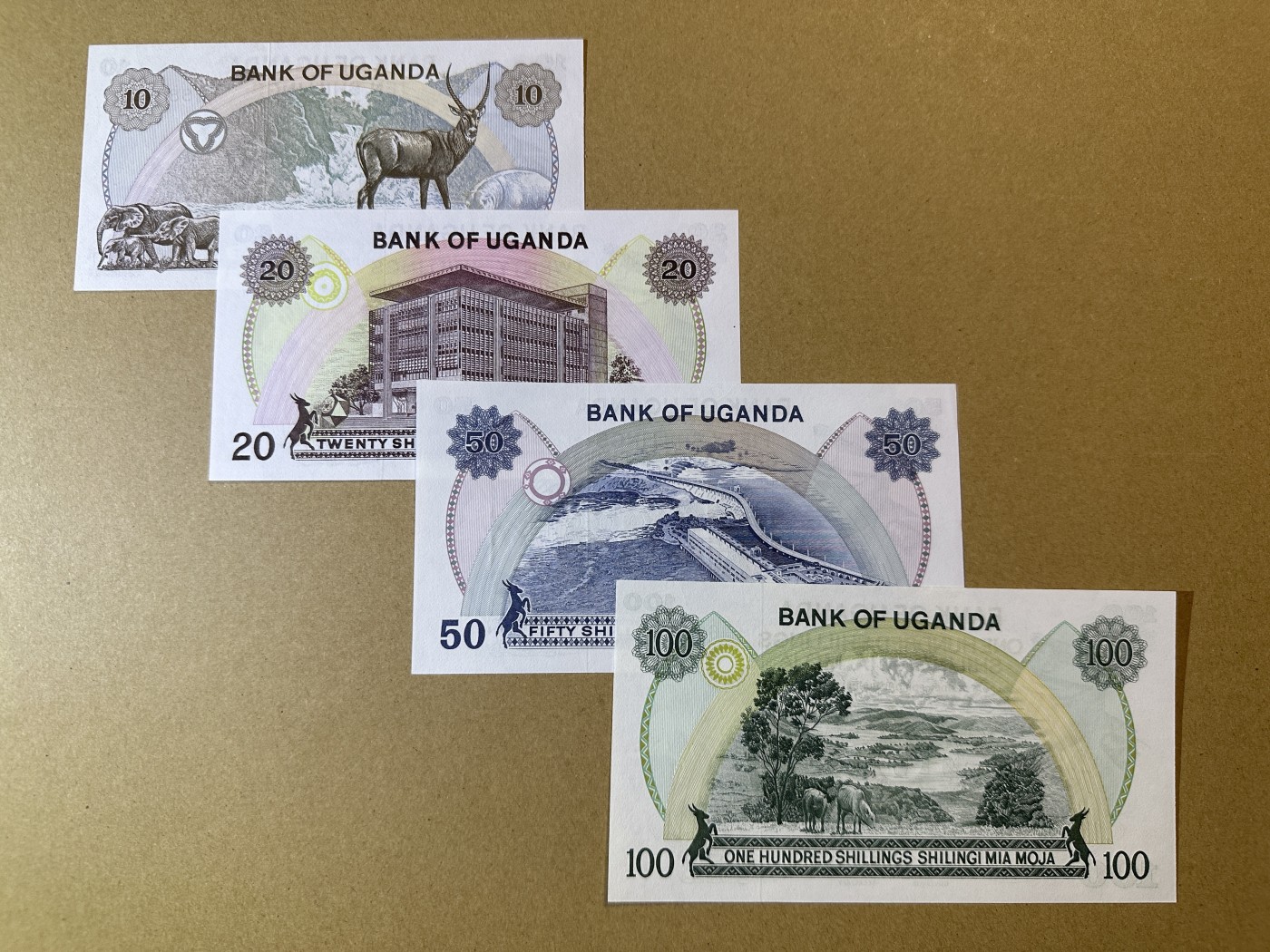 《张总收藏》110期—外币强钞 乌干达10、20、50、100先令4张 UNC 1973年