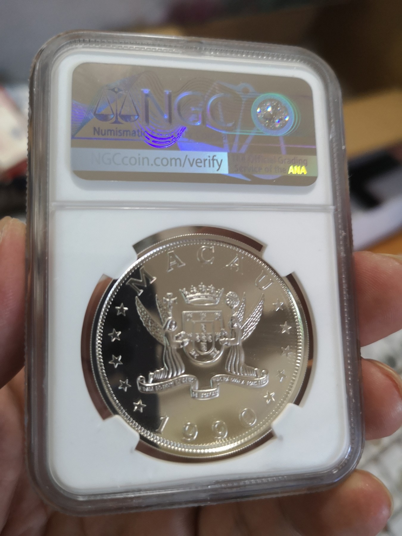 长老汇第17场儿童年评级币 1990澳门马年100元精制银币，NGC PF67UC