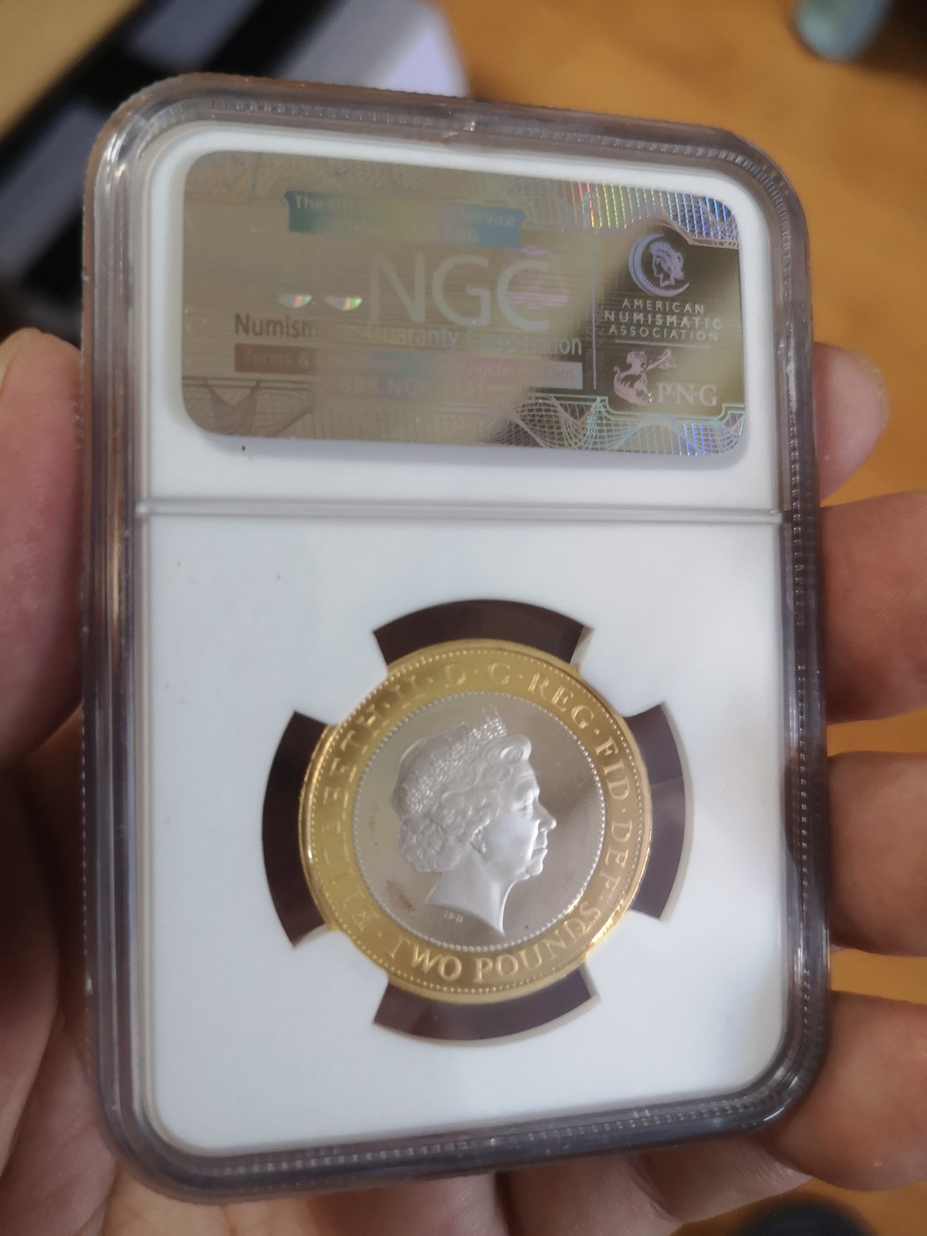 长老汇第17场儿童年评级币 2008英国奥运交接2英镑精制双色银币，NGC PF69UC